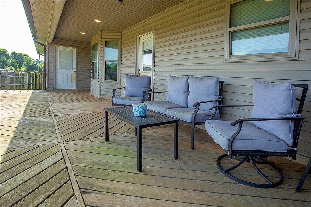 3726 St Joe Road Atkins, AR 72823 - Photo 7 of 41 Spacious exterior deck featuring a patterned wood floor, recessed lighting, and a bay window