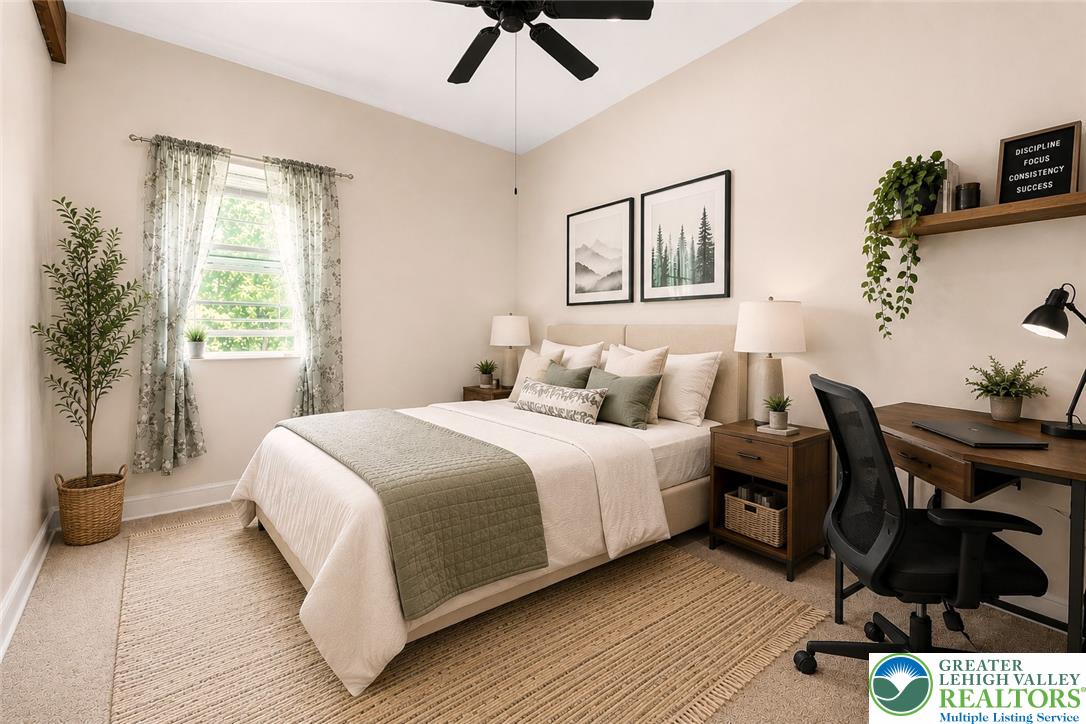 1007 Hampstead Road Bushkill, PA 18324 - Photo 38 of 72 A well-lit bedroom features vaulted ceilings and ample space for rest or productivity.