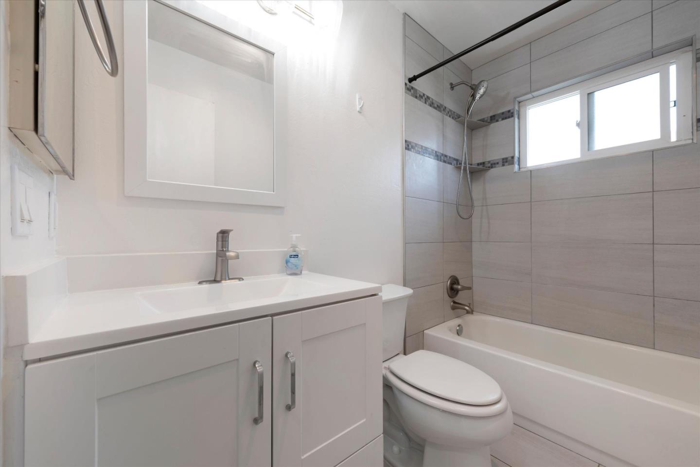 2025 California Street, Unit 42 Mountain View, CA 94040 - Photo 14 of 16 a bathroom with a sink a toilet and shower