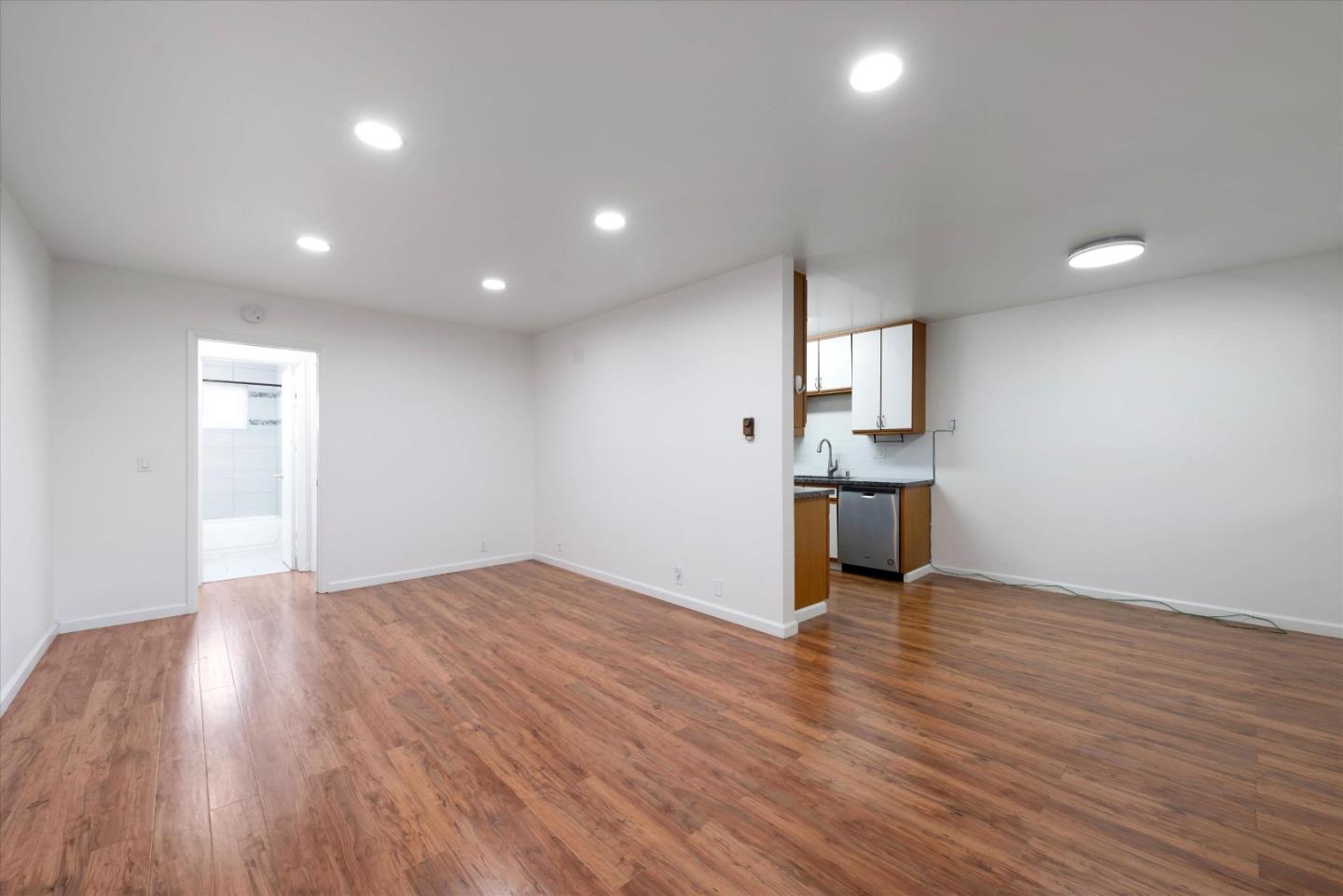 2025 California Street, Unit 42 Mountain View, CA 94040 - Photo 7 of 16 a view of kitchen with sink and wooden floor