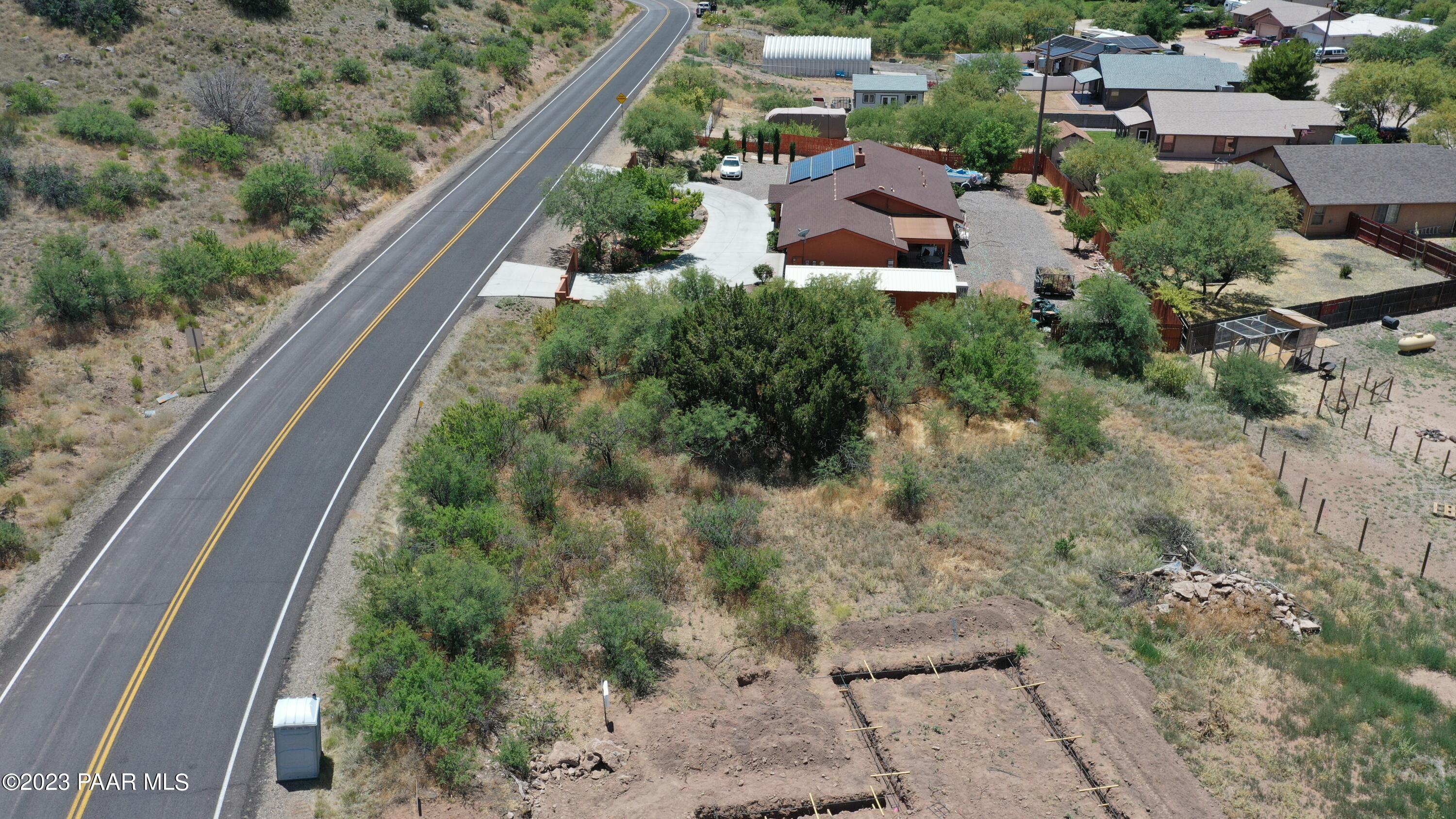 4839 East Beaver Creek Road Rimrock, AZ 86335 - Photo 11 of 22 a view of a garden with a building in the background