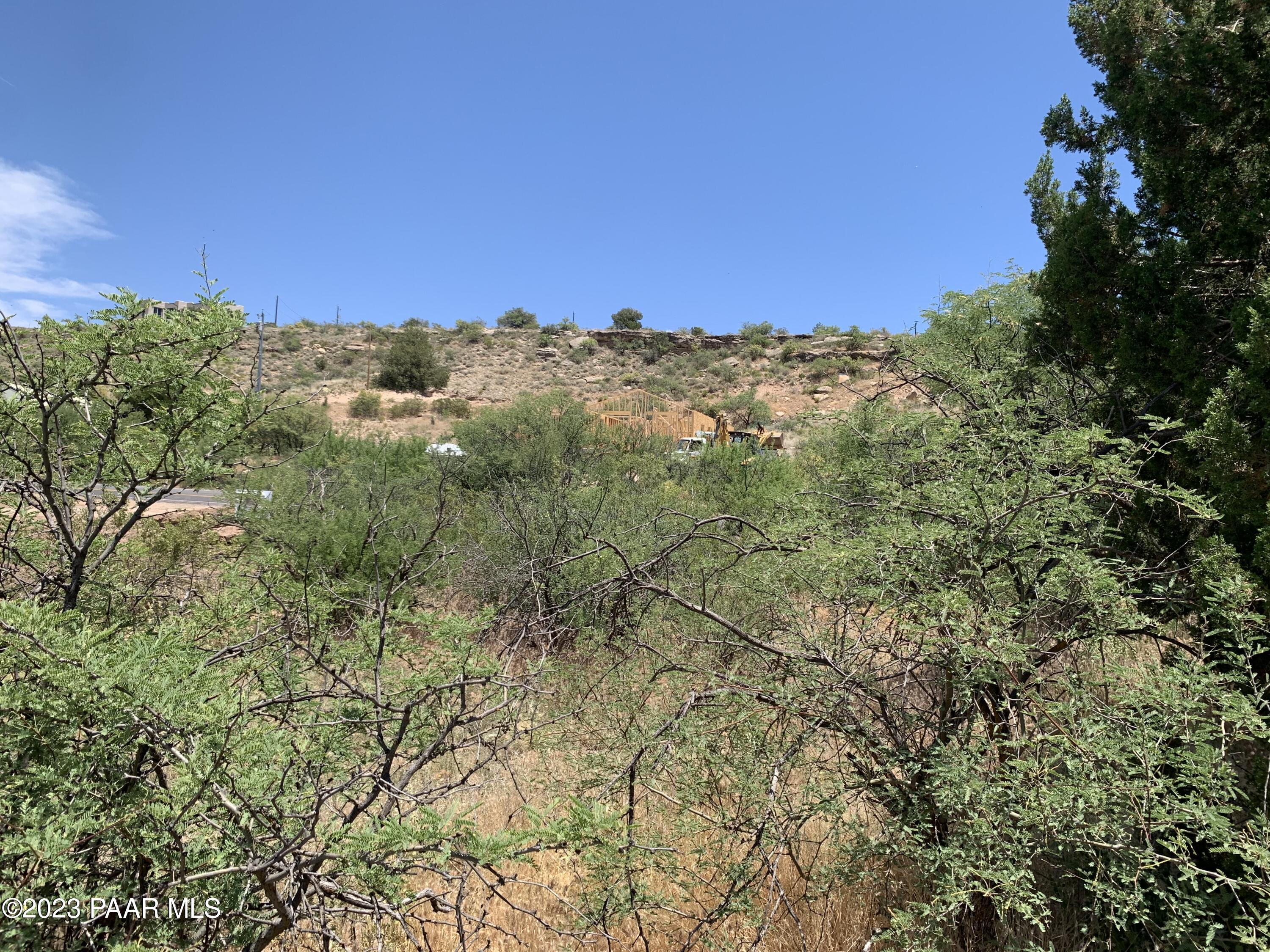 4839 East Beaver Creek Road Rimrock, AZ 86335 - Photo 22 of 22 a view of a large building with a mountain in the background