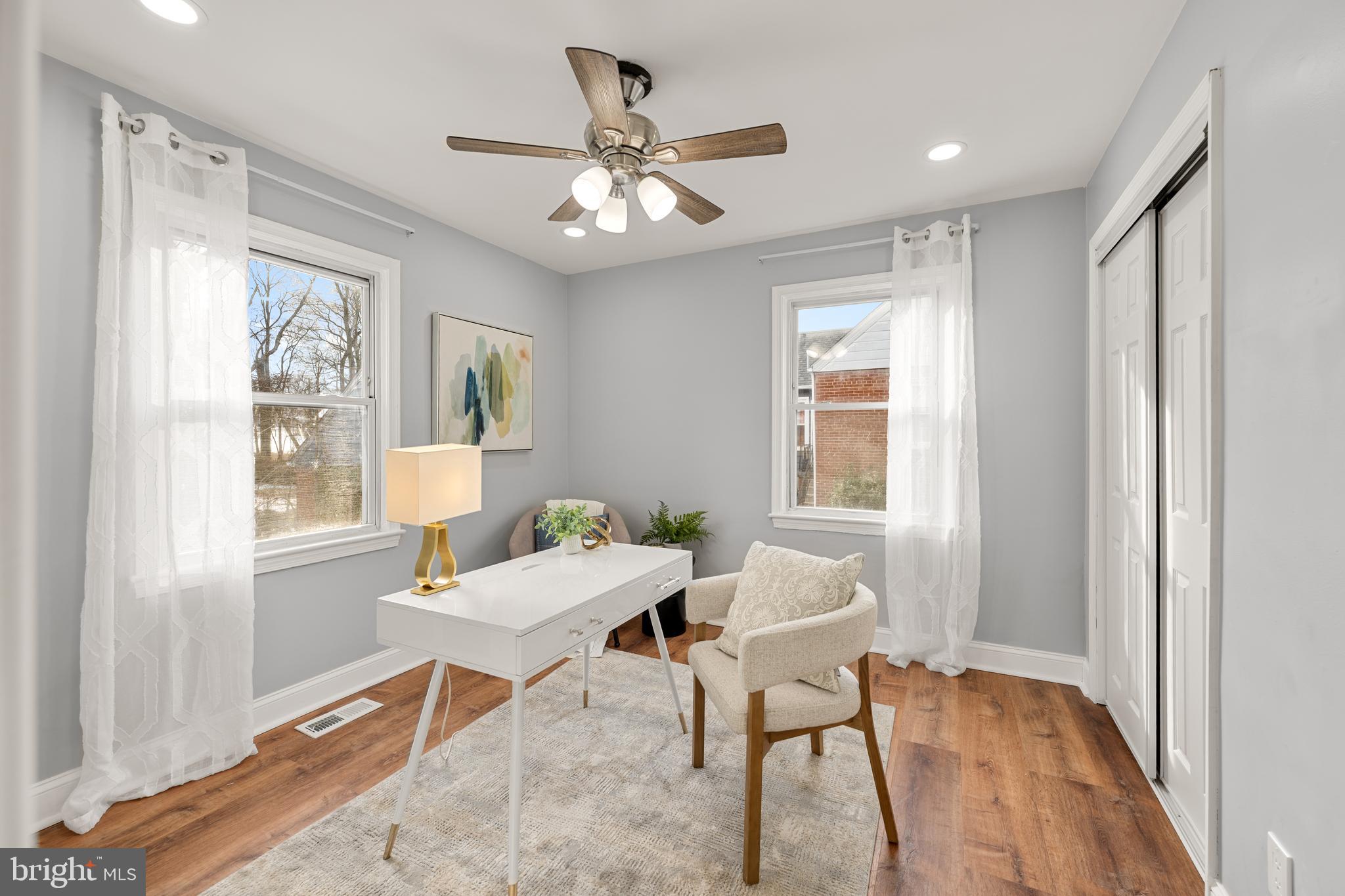 6439 Bock Road Oxon Hill, MD 20745 - Photo 19 of 38 a workspace with wooden floor and a window