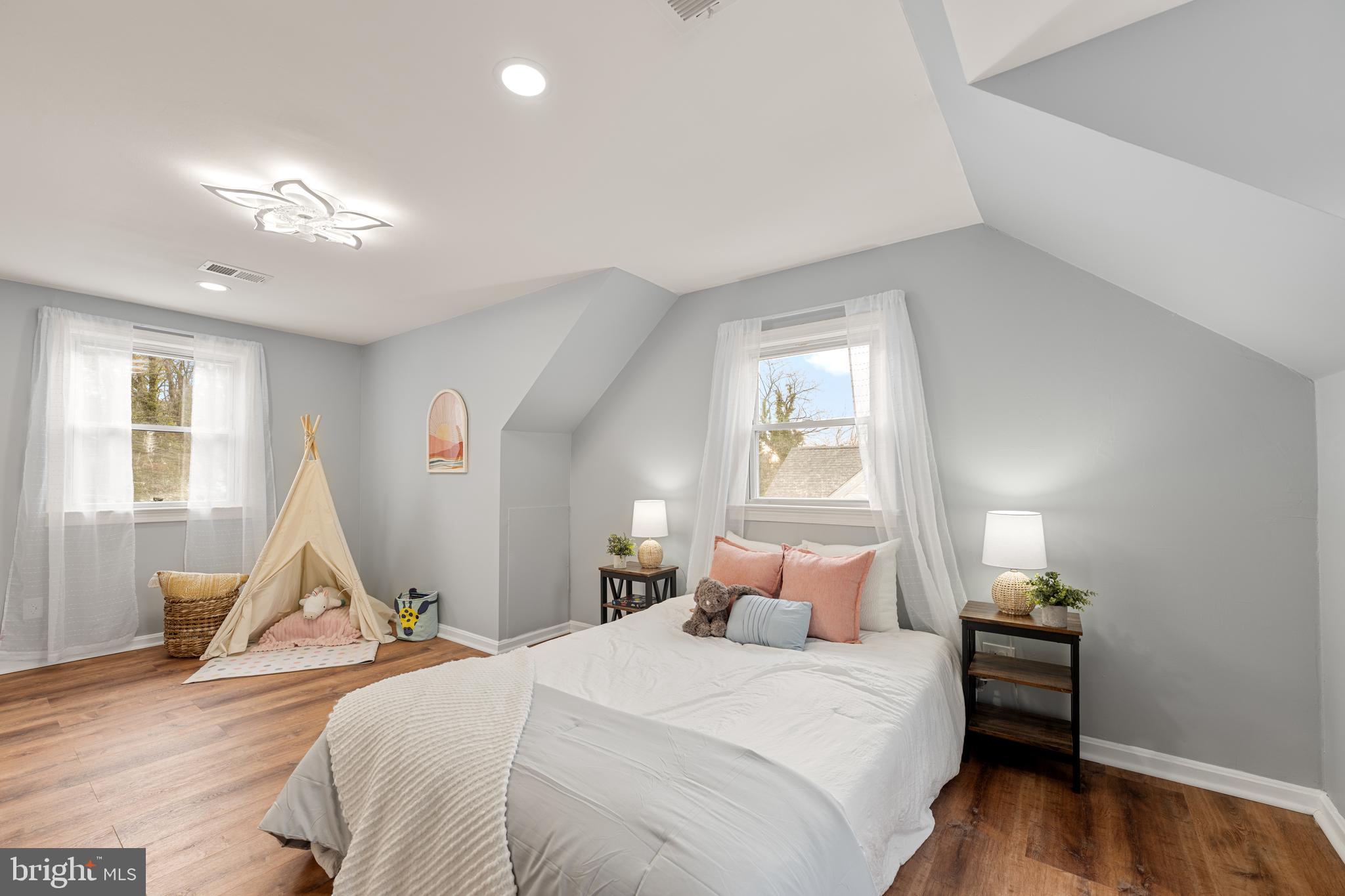 6439 Bock Road Oxon Hill, MD 20745 - Photo 20 of 38 a bedroom with a bed and wooden floor