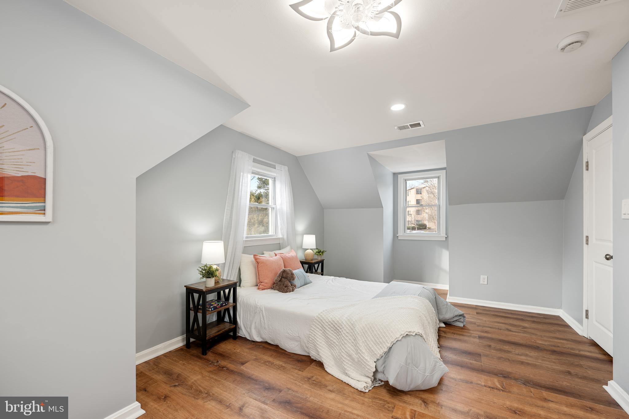 6439 Bock Road Oxon Hill, MD 20745 - Photo 21 of 38 a bedroom with a bed and wooden floor