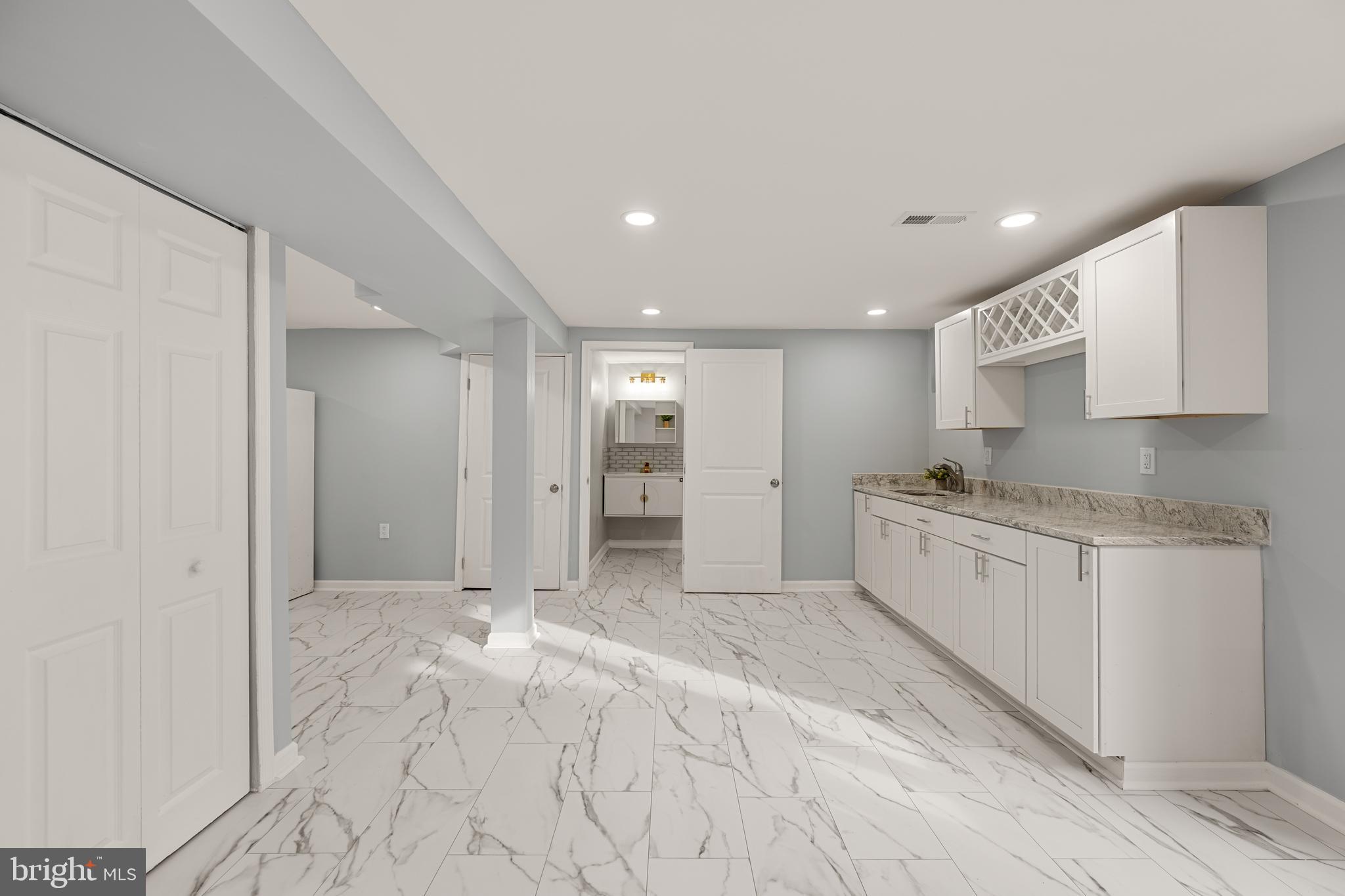 6439 Bock Road Oxon Hill, MD 20745 - Photo 29 of 38 a large white kitchen with a sink