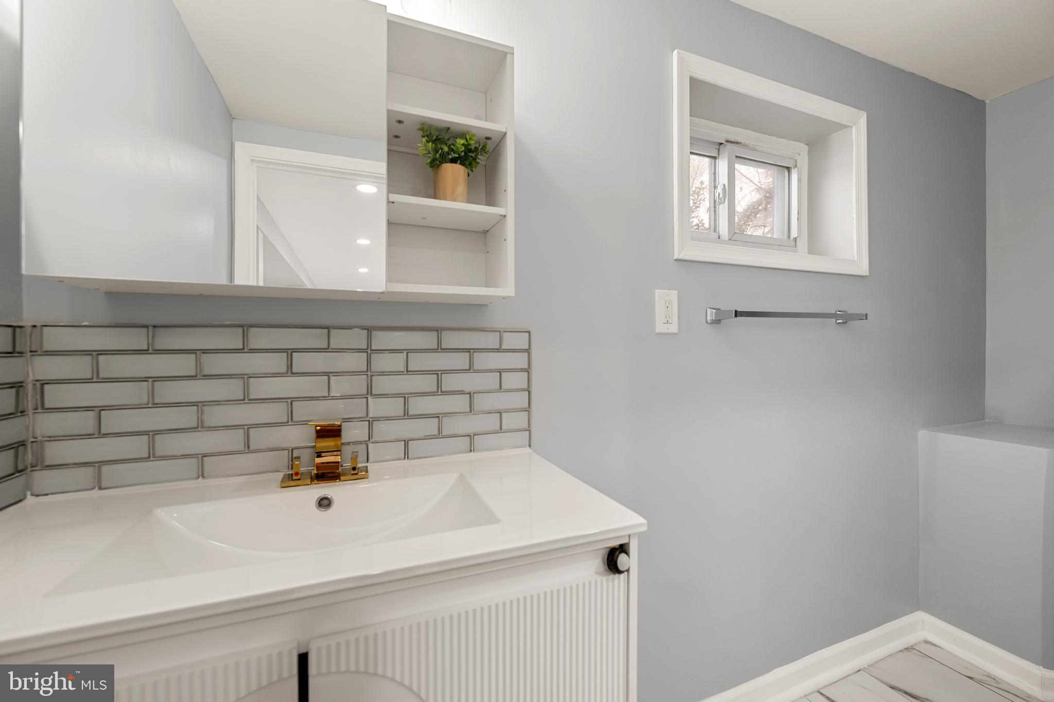 6439 Bock Road Oxon Hill, MD 20745 - Photo 31 of 38 a bathroom with a sink and a bathtub