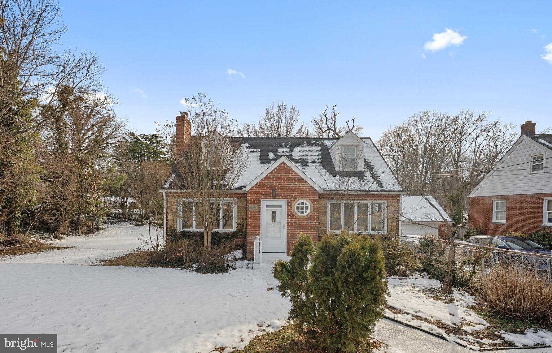 6439 Bock Road Oxon Hill, MD 20745 - Photo 38 of 38 a front view of a house with a yard and garage