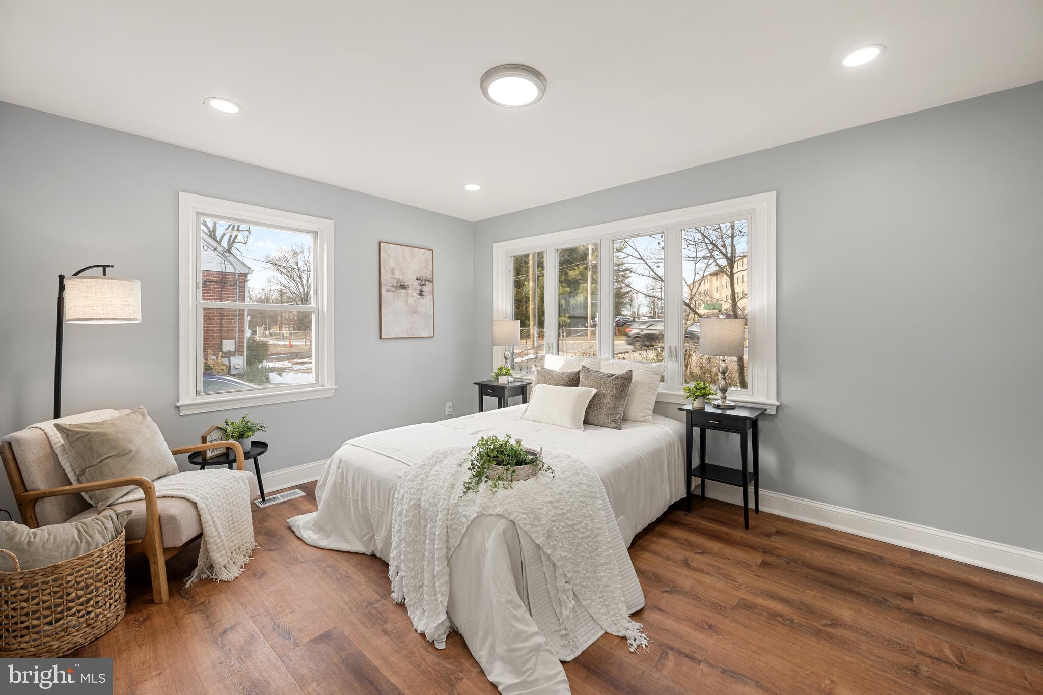 6439 Bock Road Oxon Hill, MD 20745 - Photo 4 of 38 a bedroom with a bed and wooden floor
