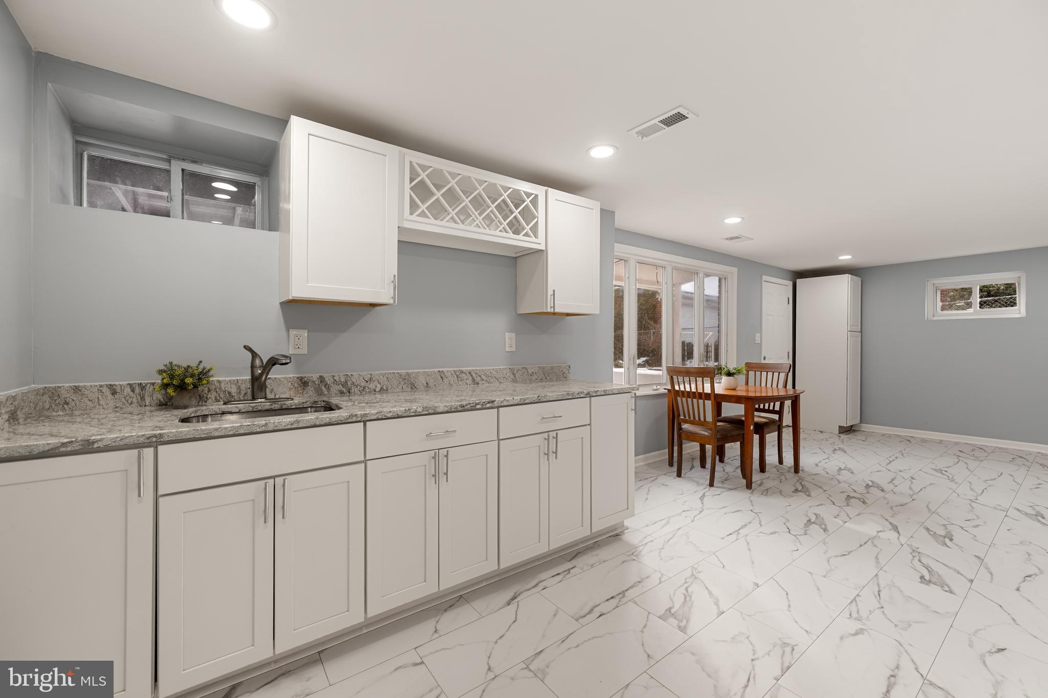 6439 Bock Road Oxon Hill, MD 20745 - Photo 5 of 38 a kitchen with granite countertop a sink and cabinets