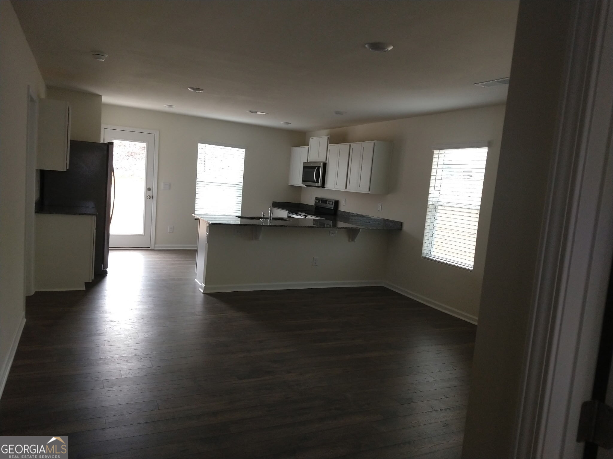 51 Lake Terrace Circle LaFayette, GA 30728 - Photo 2 of 8 a kitchen with granite countertop a stove top oven a sink and a window