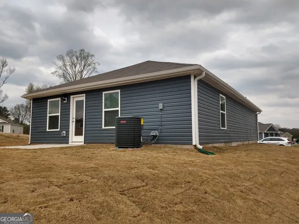 a front view of house with yard