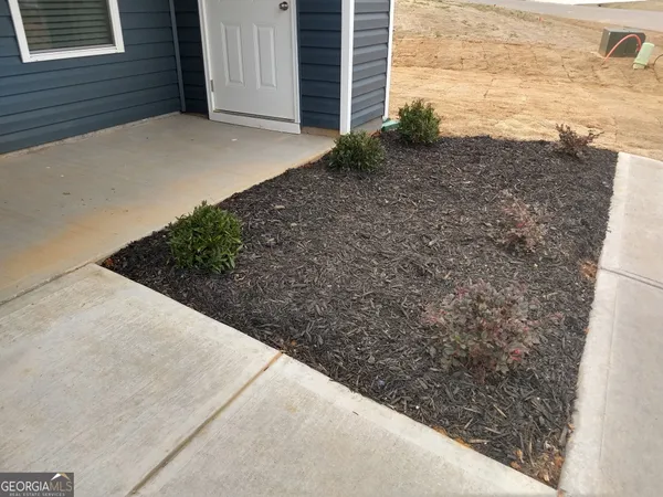 a view of a backyard of the house