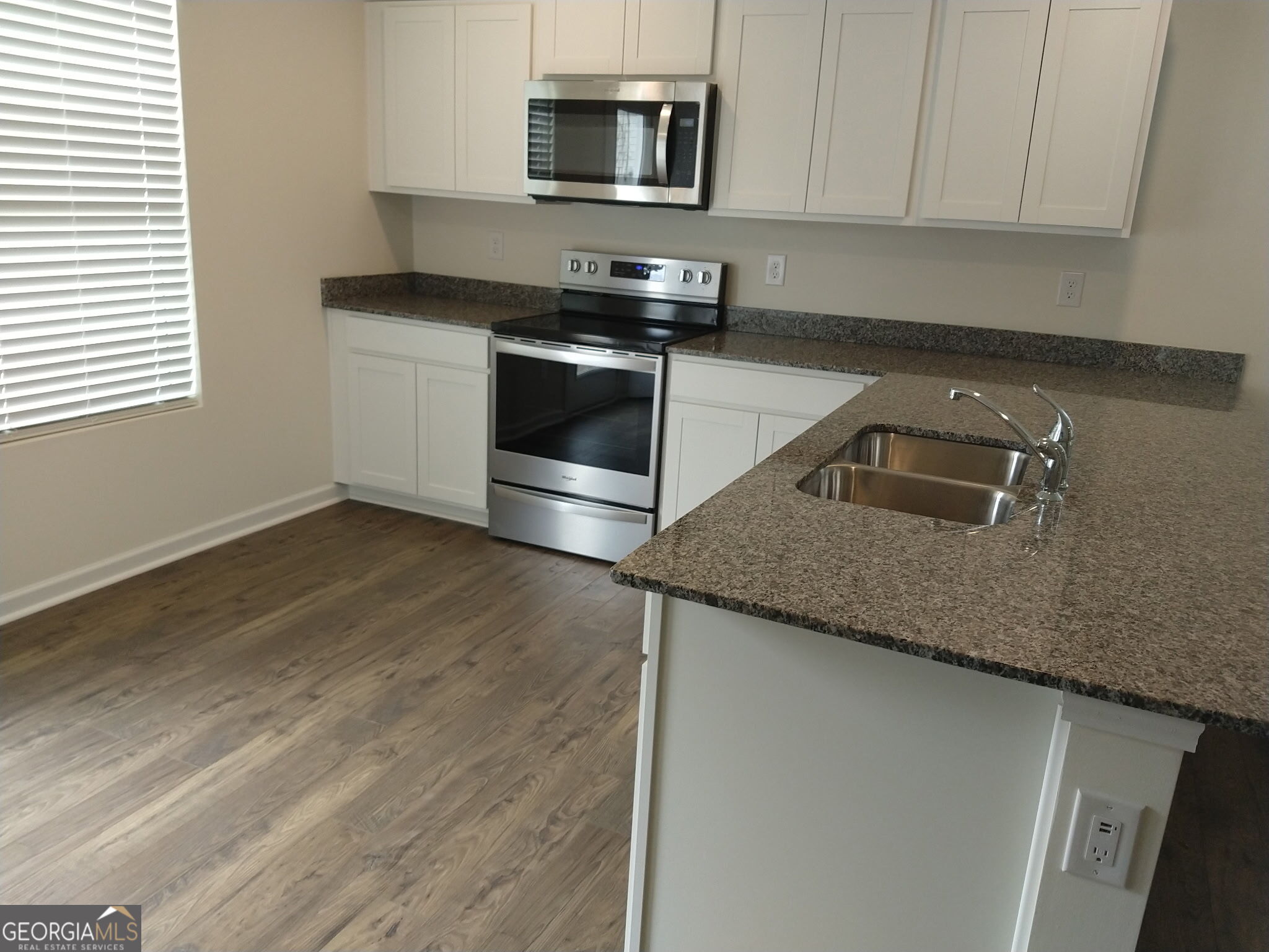 51 Lake Terrace Circle LaFayette, GA 30728 - Photo 8 of 8 a kitchen with granite countertop a sink and a stove top oven