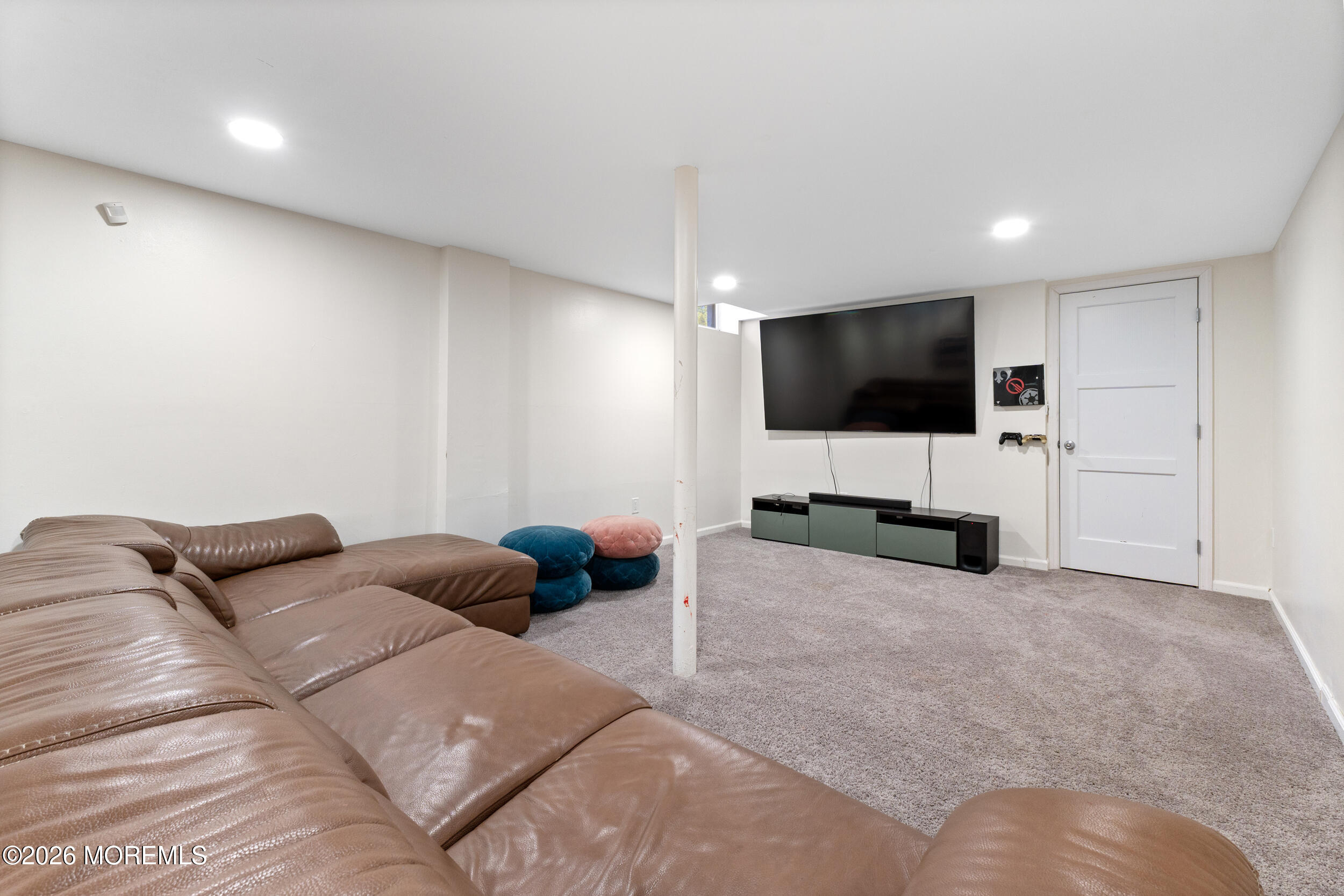104 Autumn Road Matawan, NJ 07747 - Photo 43 of 64 a bedroom with a bed and a flat screen tv