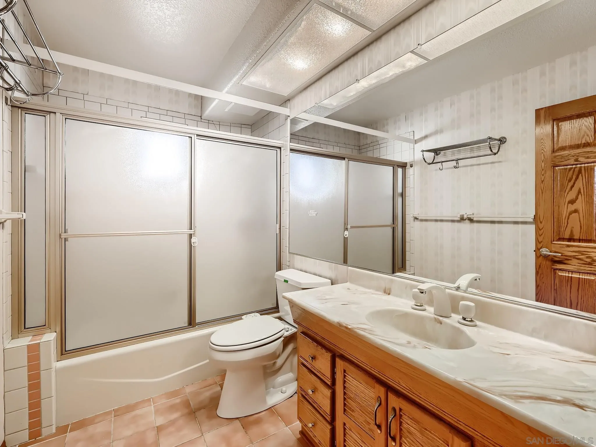 20509 Bexley Road Jamul, CA 91935 - Photo 13 of 28 a bathroom with a granite countertop sink toilet and shower