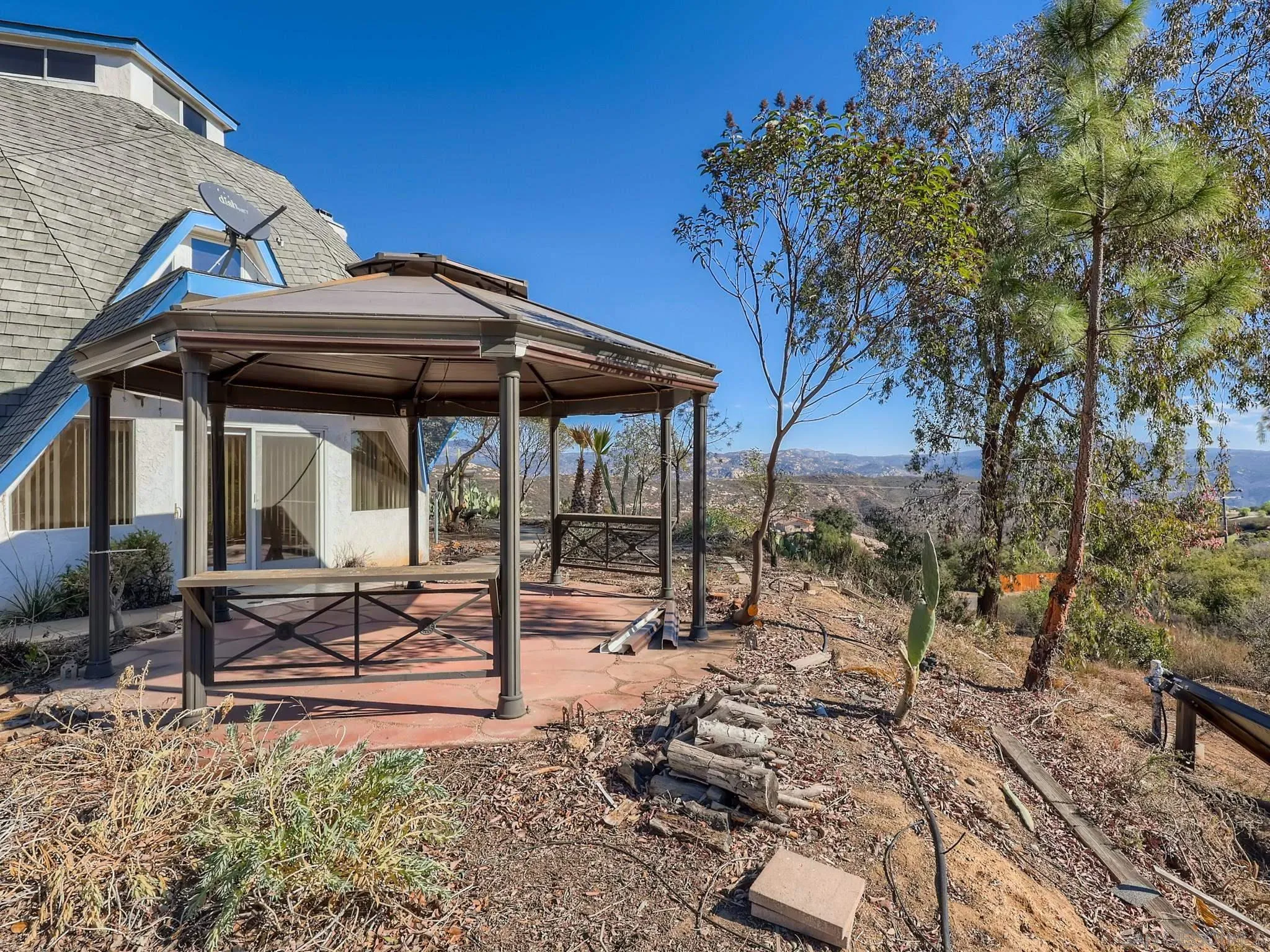 20509 Bexley Road Jamul, CA 91935 - Photo 22 of 28 a view of a house with backyard and chairs