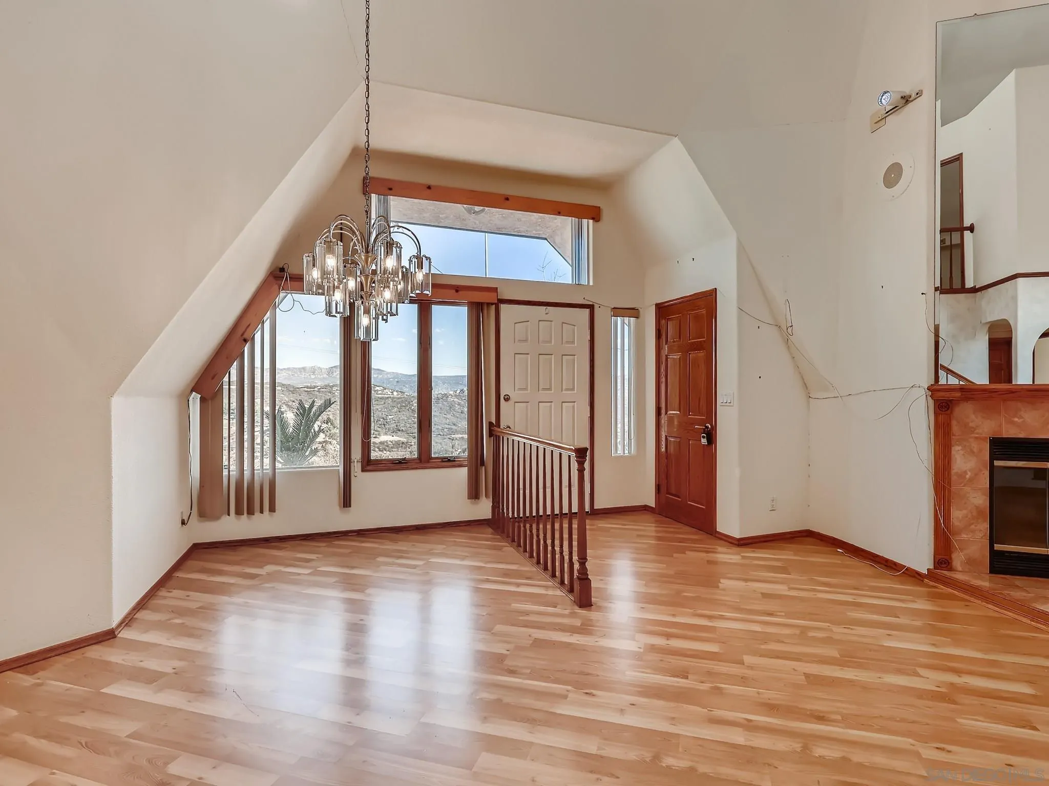 20509 Bexley Road Jamul, CA 91935 - Photo 5 of 28 a view of an empty room with wooden floor and a window