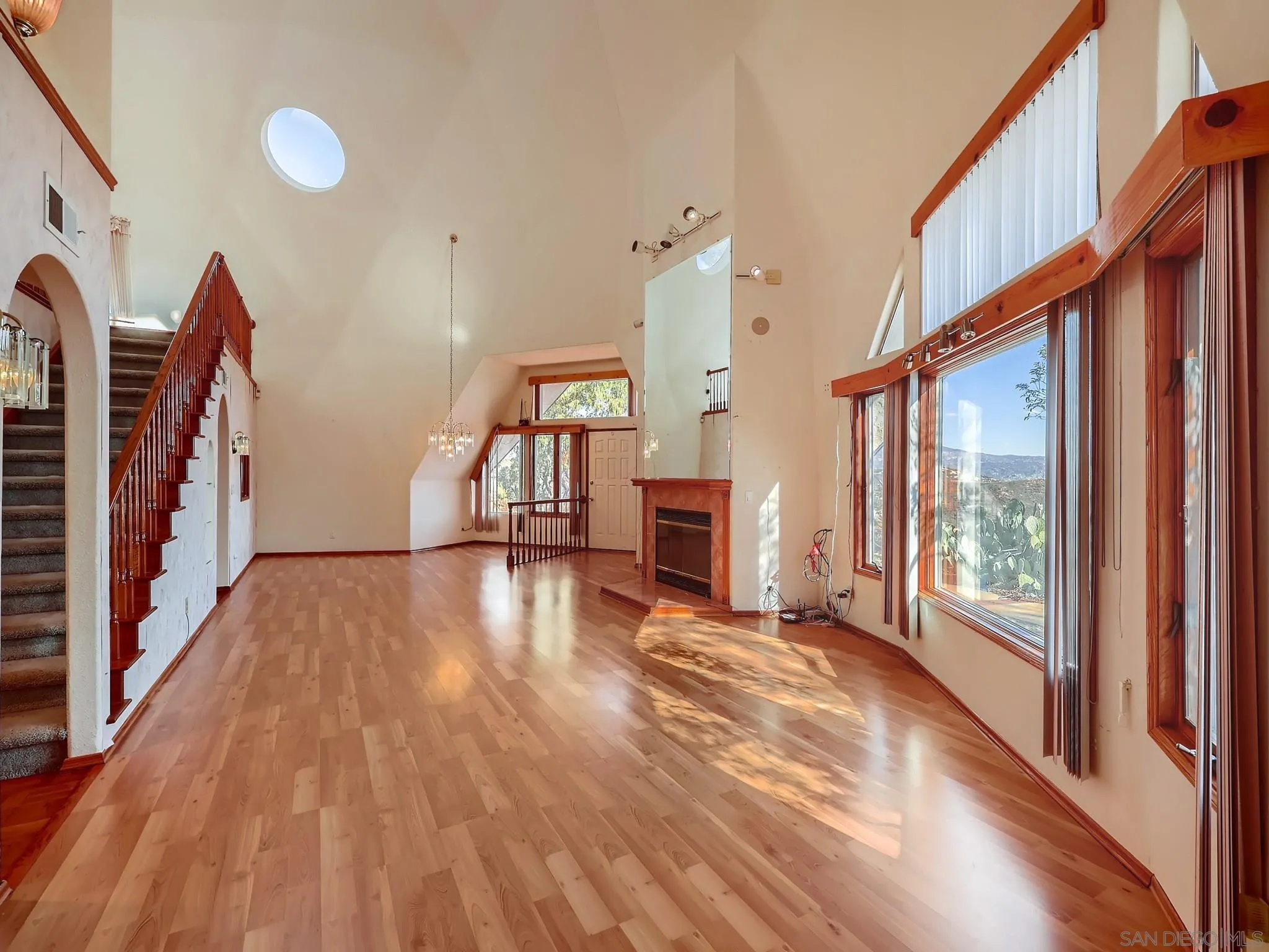20509 Bexley Road Jamul, CA 91935 - Photo 8 of 28 a view of empty room with wooden floor and fan