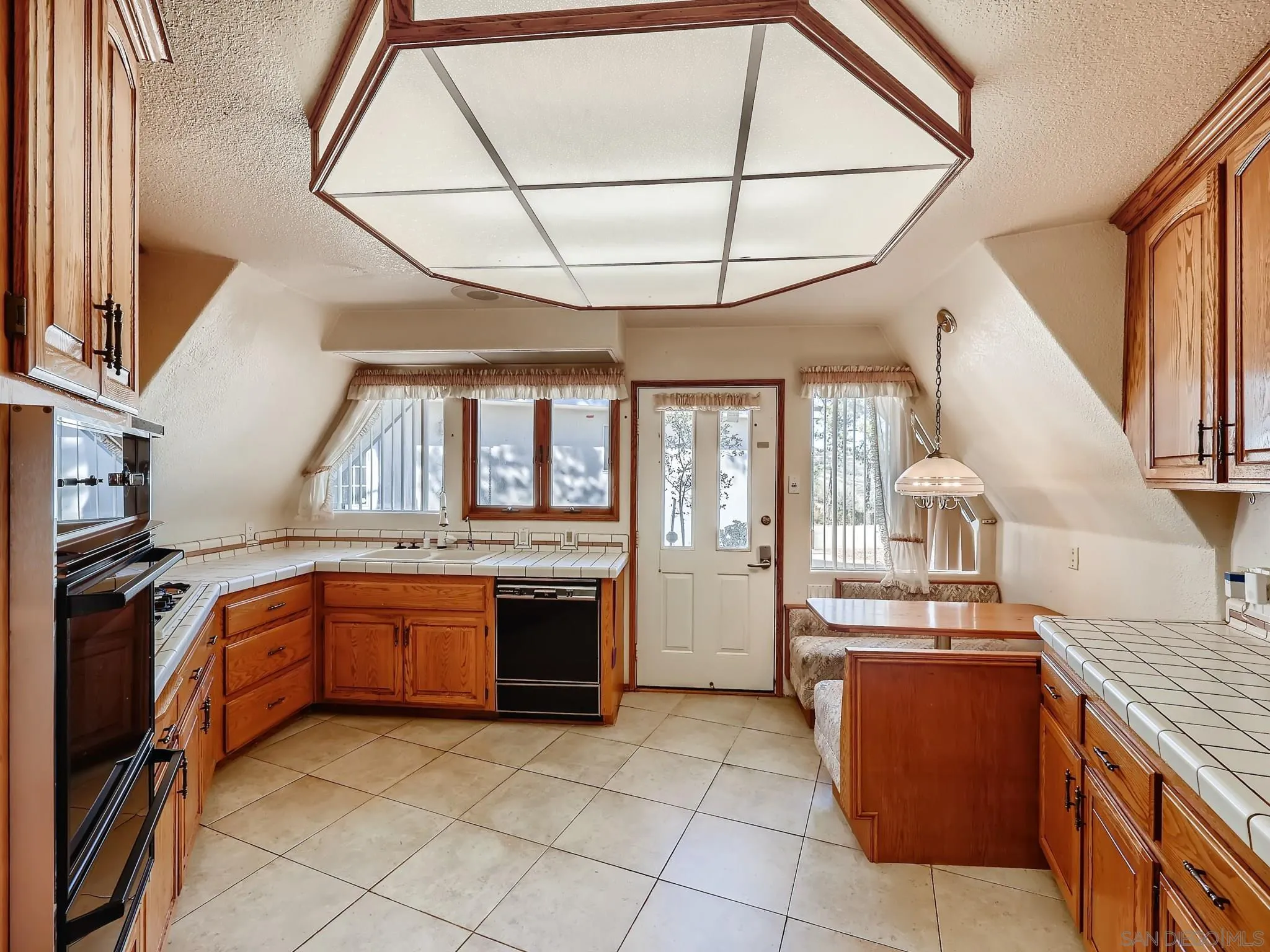 20509 Bexley Road Jamul, CA 91935 - Photo 9 of 28 a kitchen with stainless steel appliances granite countertop a stove and a sink