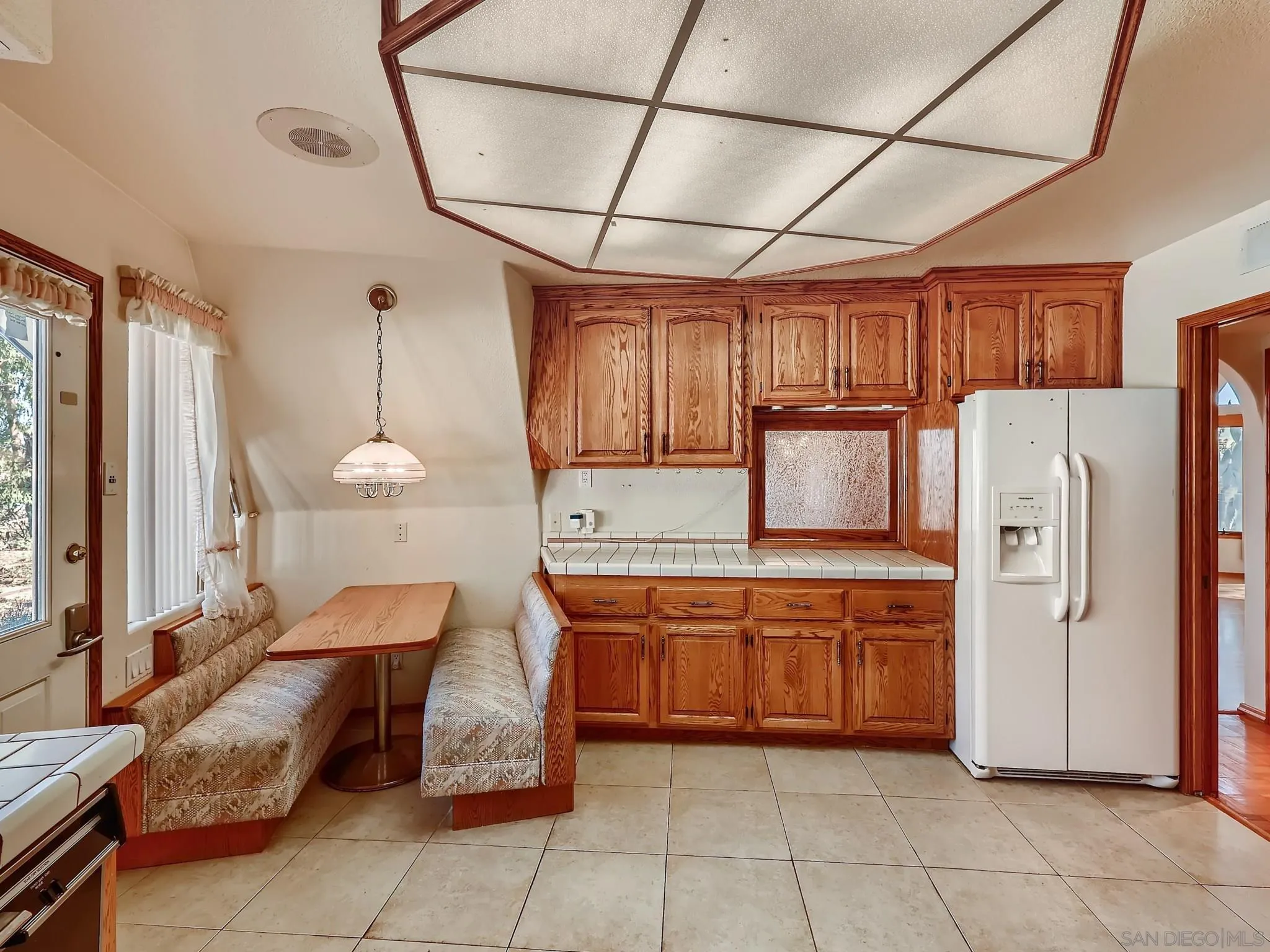 20509 Bexley Road Jamul, CA 91935 - Photo 10 of 28 a kitchen with stainless steel appliances granite countertop a sink and a refrigerator
