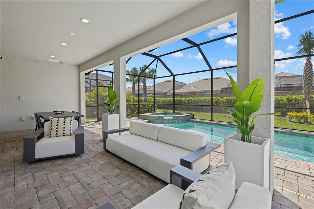 3508 Anchor Bay Trail Lakewood Ranch, FL 34211 - Photo 38 of 74 a living room with furniture and a large window