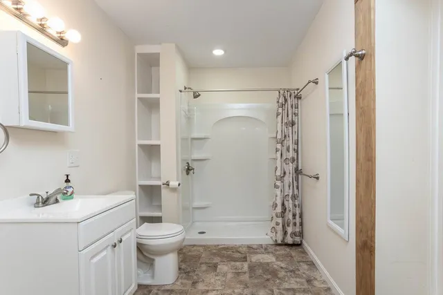 a bathroom with a sink toilet and vanity