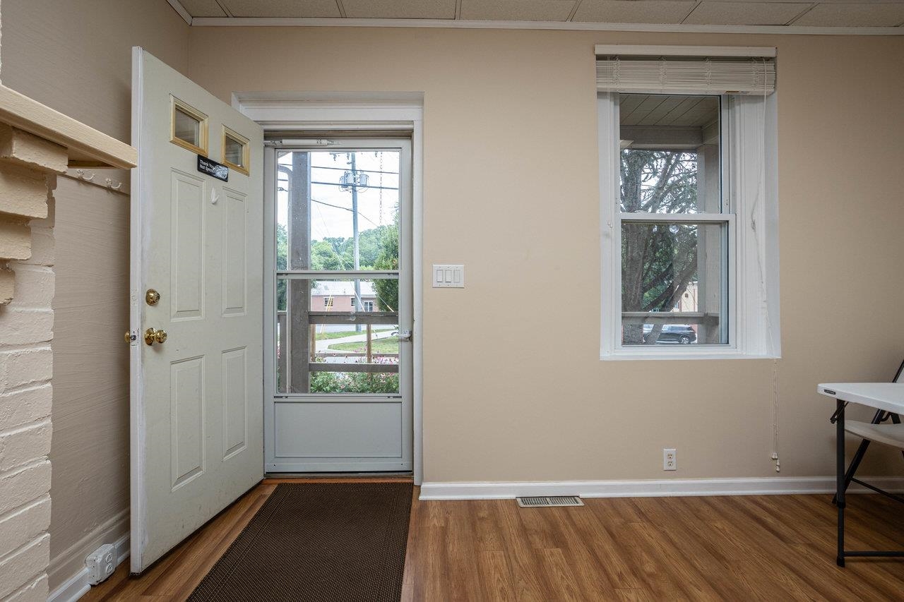 2408 Cedar Street Staunton, VA 24401 - Photo 3 of 54 a view of an empty room with wooden floor and a window