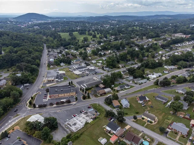 a view of a house with pool and sitting area