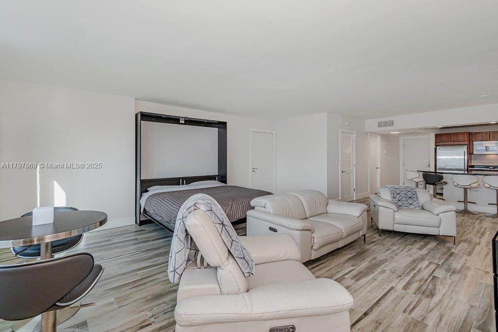 2301 Collins Avenue, Unit 1532 Miami Beach, FL 33139 - Photo 11 of 28 a living room with furniture