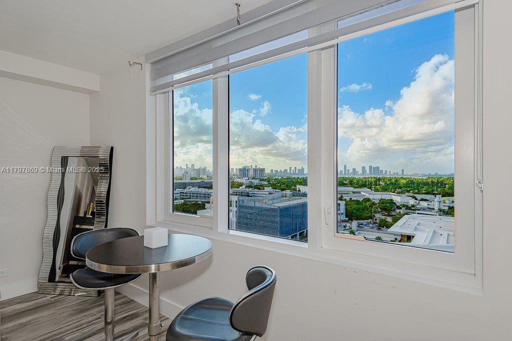 2301 Collins Avenue, Unit 1532 Miami Beach, FL 33139 - Photo 16 of 28 a room with furniture and a floor to ceiling window