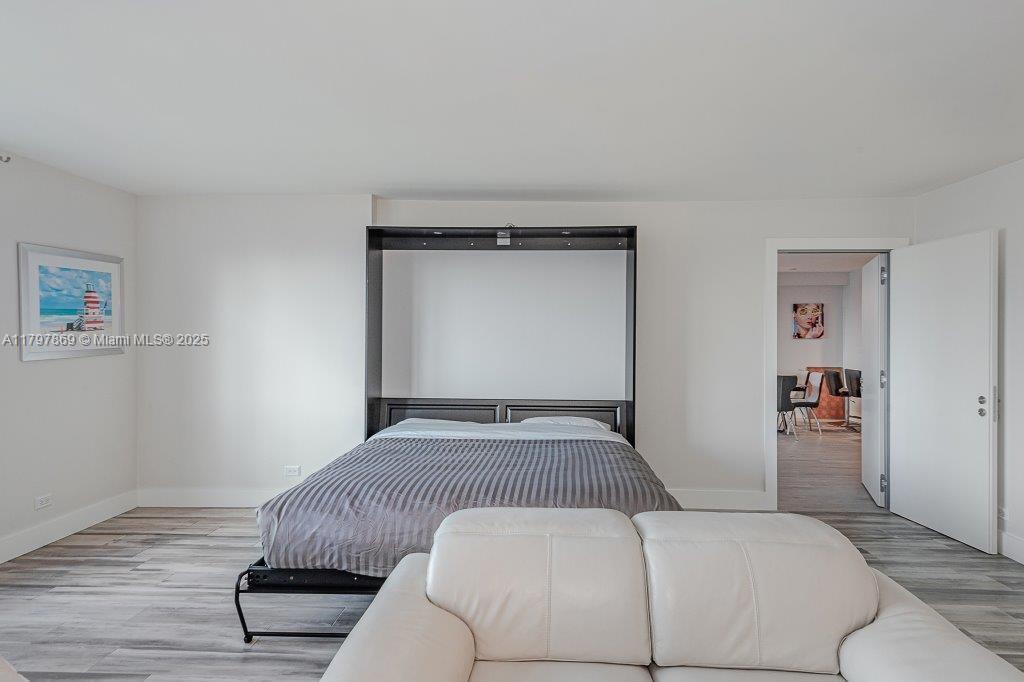 2301 Collins Avenue, Unit 1532 Miami Beach, FL 33139 - Photo 17 of 28 a bedroom with a bed and window