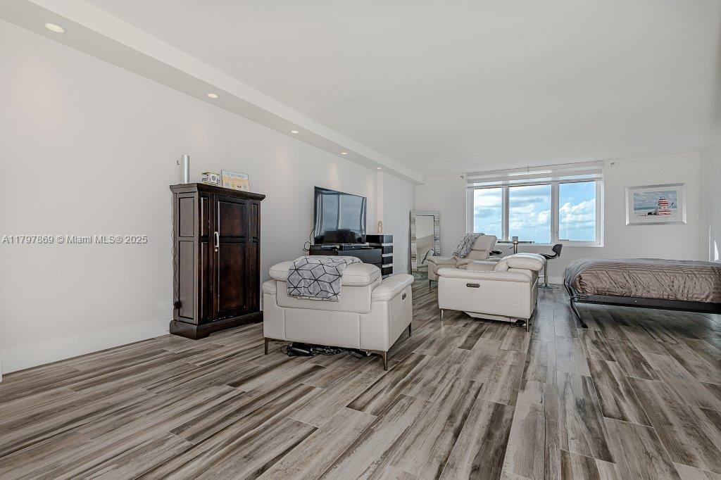 2301 Collins Avenue, Unit 1532 Miami Beach, FL 33139 - Photo 4 of 28 a living room with furniture and a wooden floor