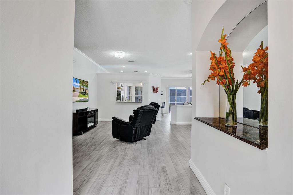13129 Southwest 32nd Street Miramar, FL 33027 - Photo 9 of 38 a living room with furniture and a potted plant