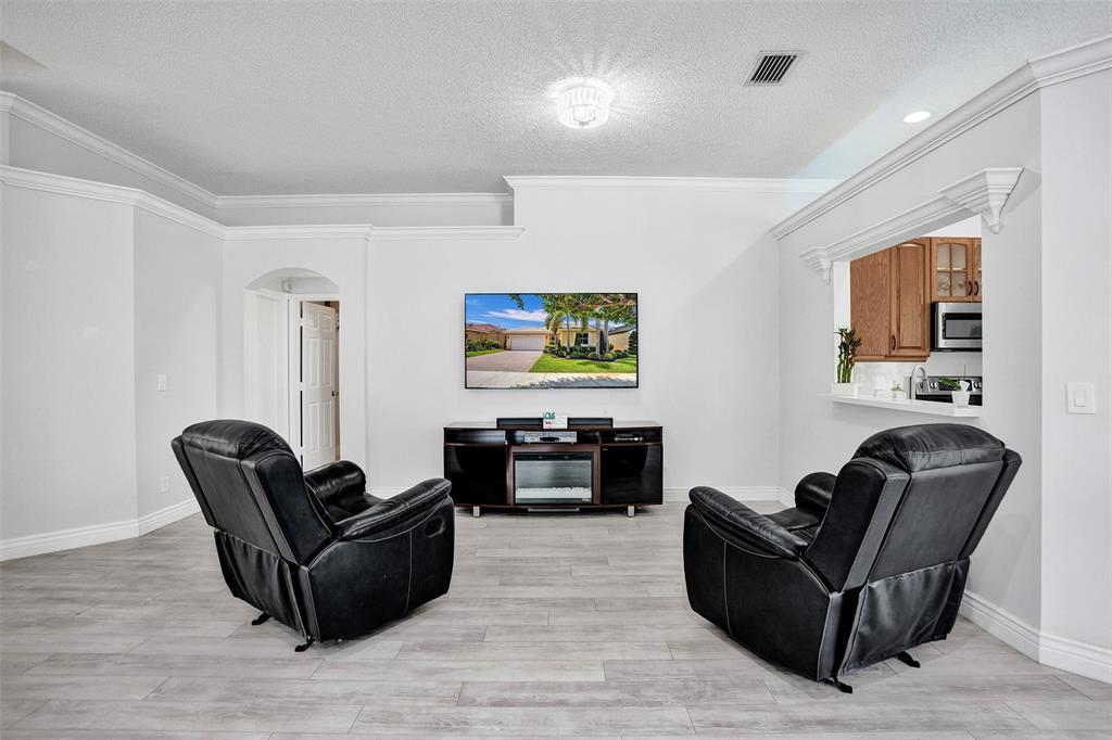 13129 Southwest 32nd Street Miramar, FL 33027 - Photo 10 of 38 a living room with furniture and a couch