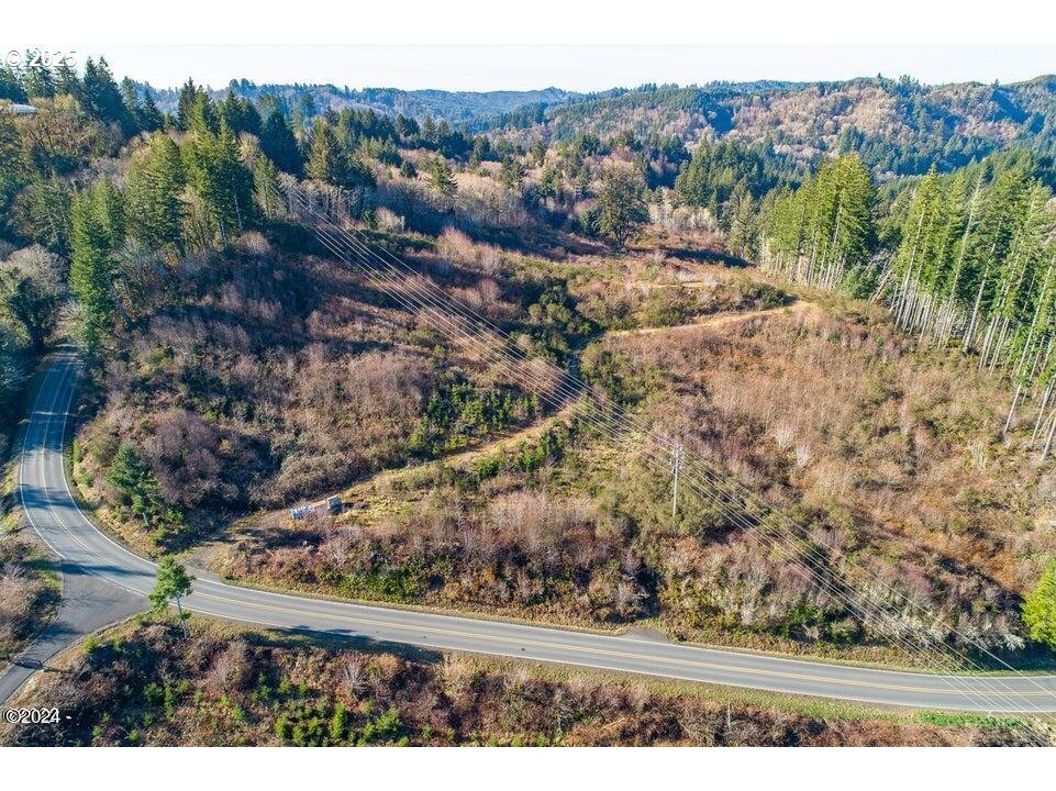 2303 Northeast Arcadia Drive, Unit 2303 Toledo, OR 97391 - Photo 12 of 18 a view of a yard with mountain view