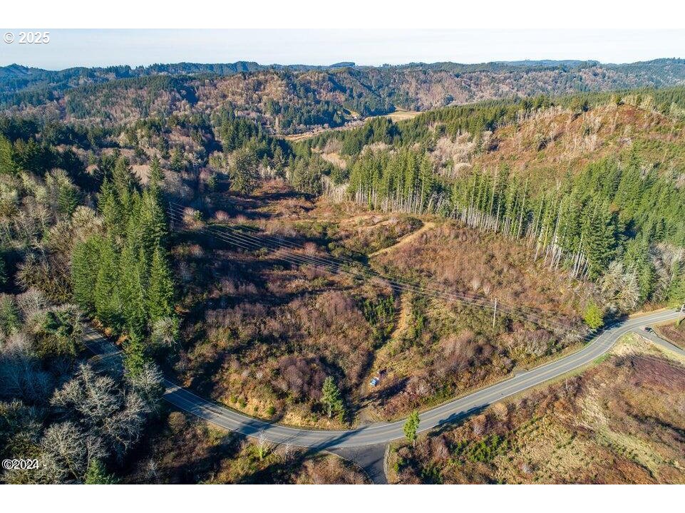 2303 Northeast Arcadia Drive, Unit 2303 Toledo, OR 97391 - Photo 6 of 18 a view of lake and mountain