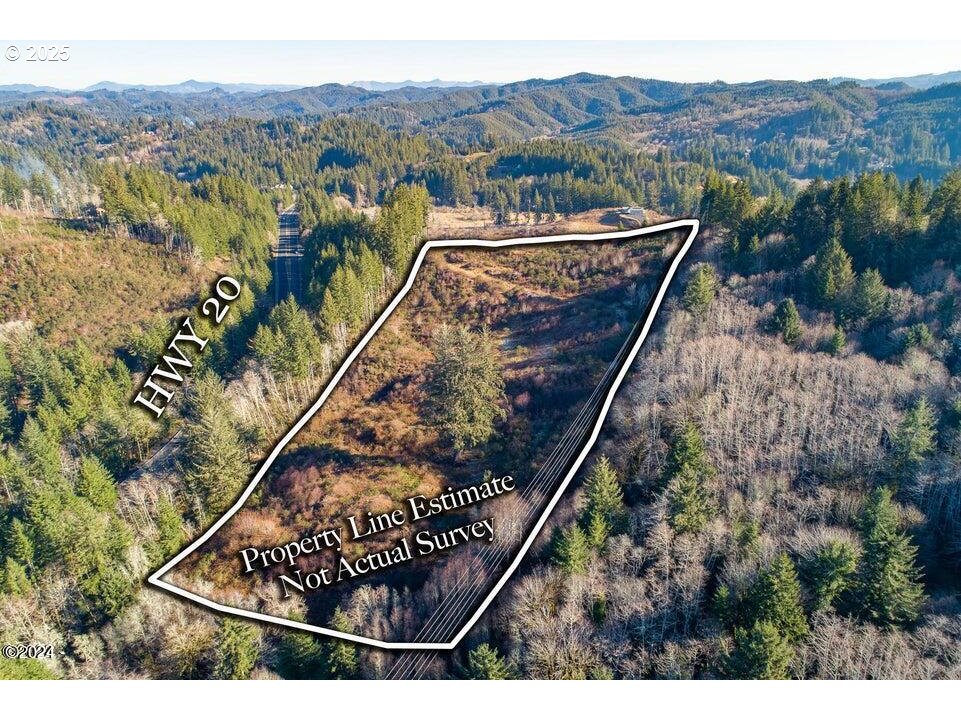 2303 Northeast Arcadia Drive, Unit 2303 Toledo, OR 97391 - Photo 8 of 18 a view of a tennis court with a mountain