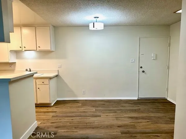 a view of kitchen and wooden floor