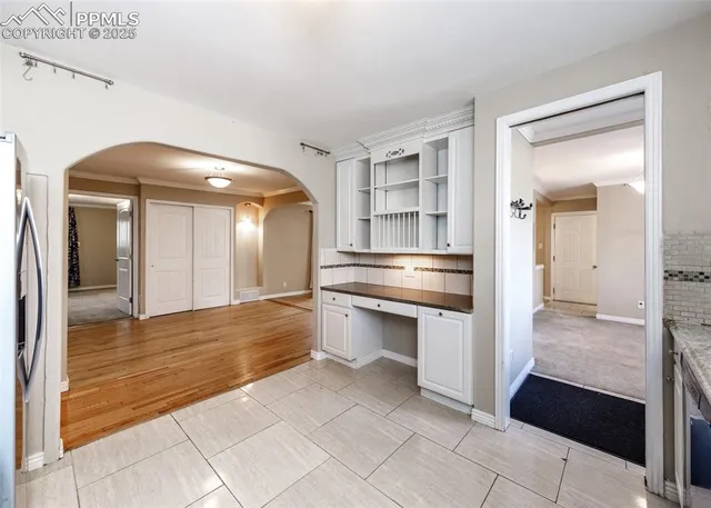 a view of a kitchen from the hallway