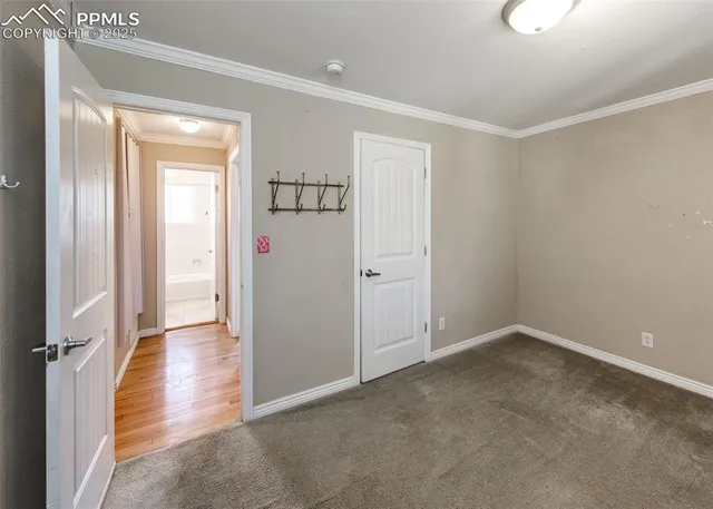 a view of an empty room and a window