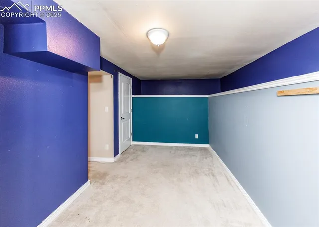 a view of a brick house with a wooden fence