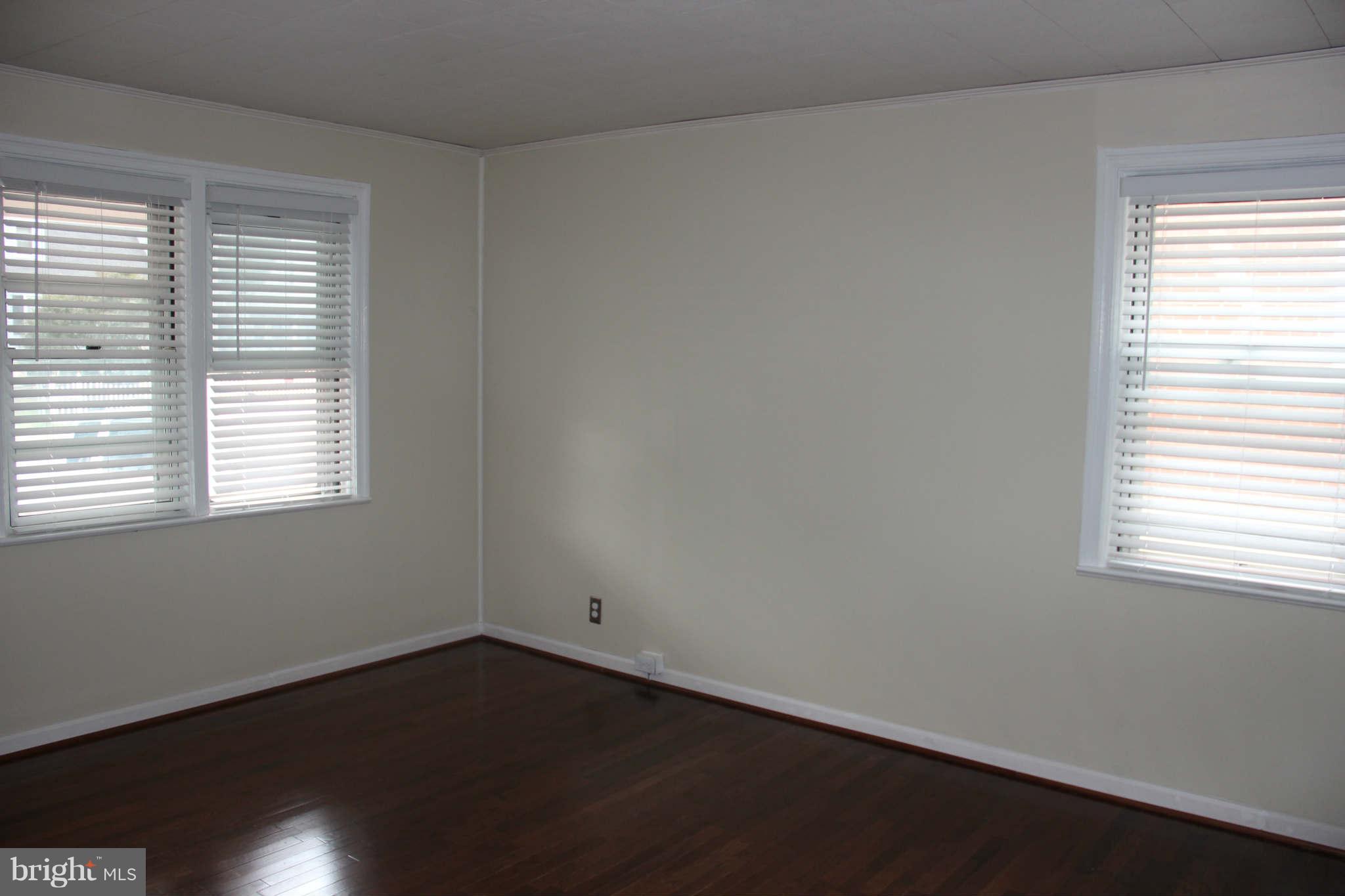 8424 Oakleigh Road Baltimore, MD 21234 - Photo 7 of 11 an empty room with a window