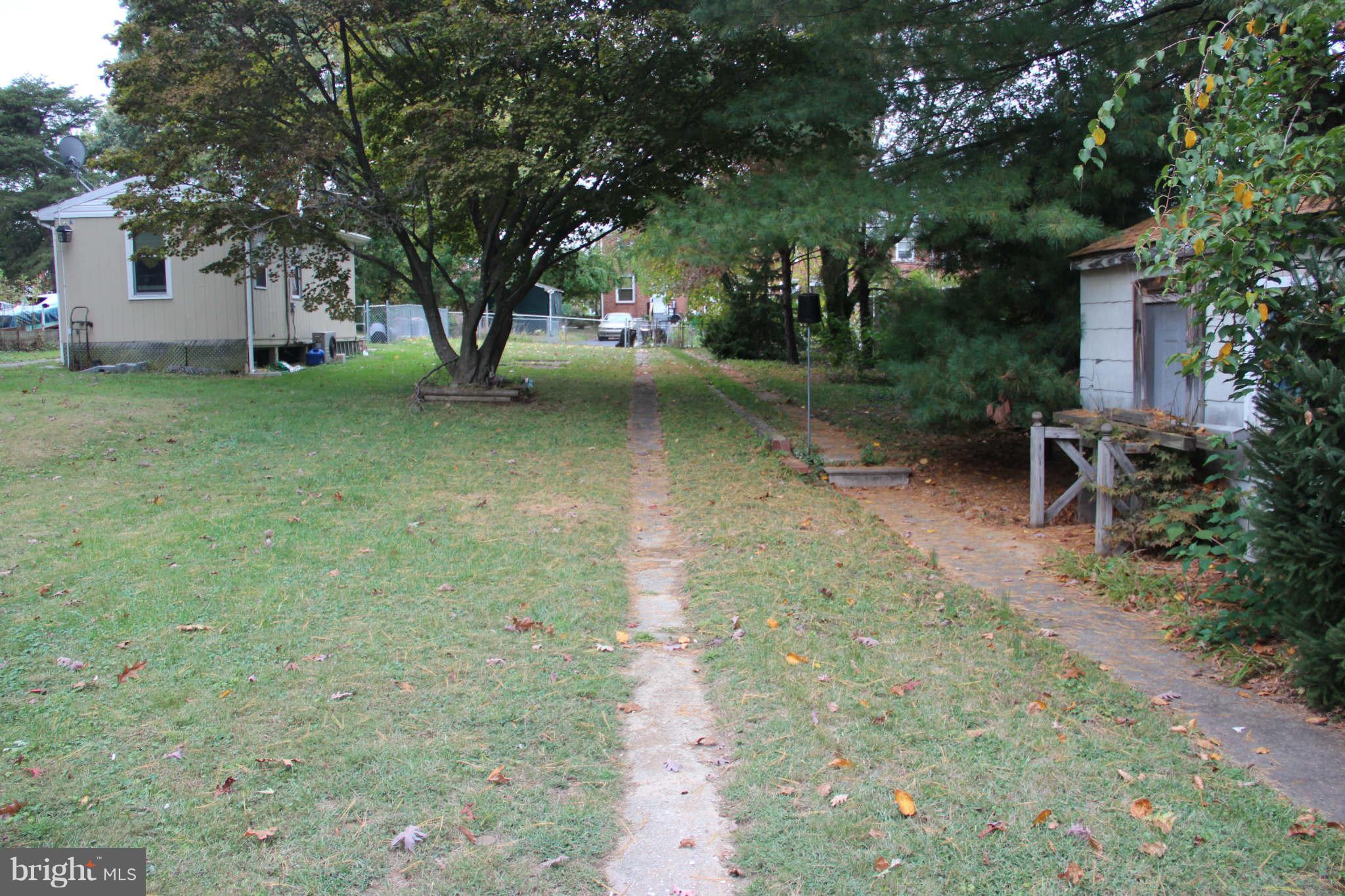 8424 Oakleigh Road Baltimore, MD 21234 - Photo 10 of 11 a view of a yard with plants and trees