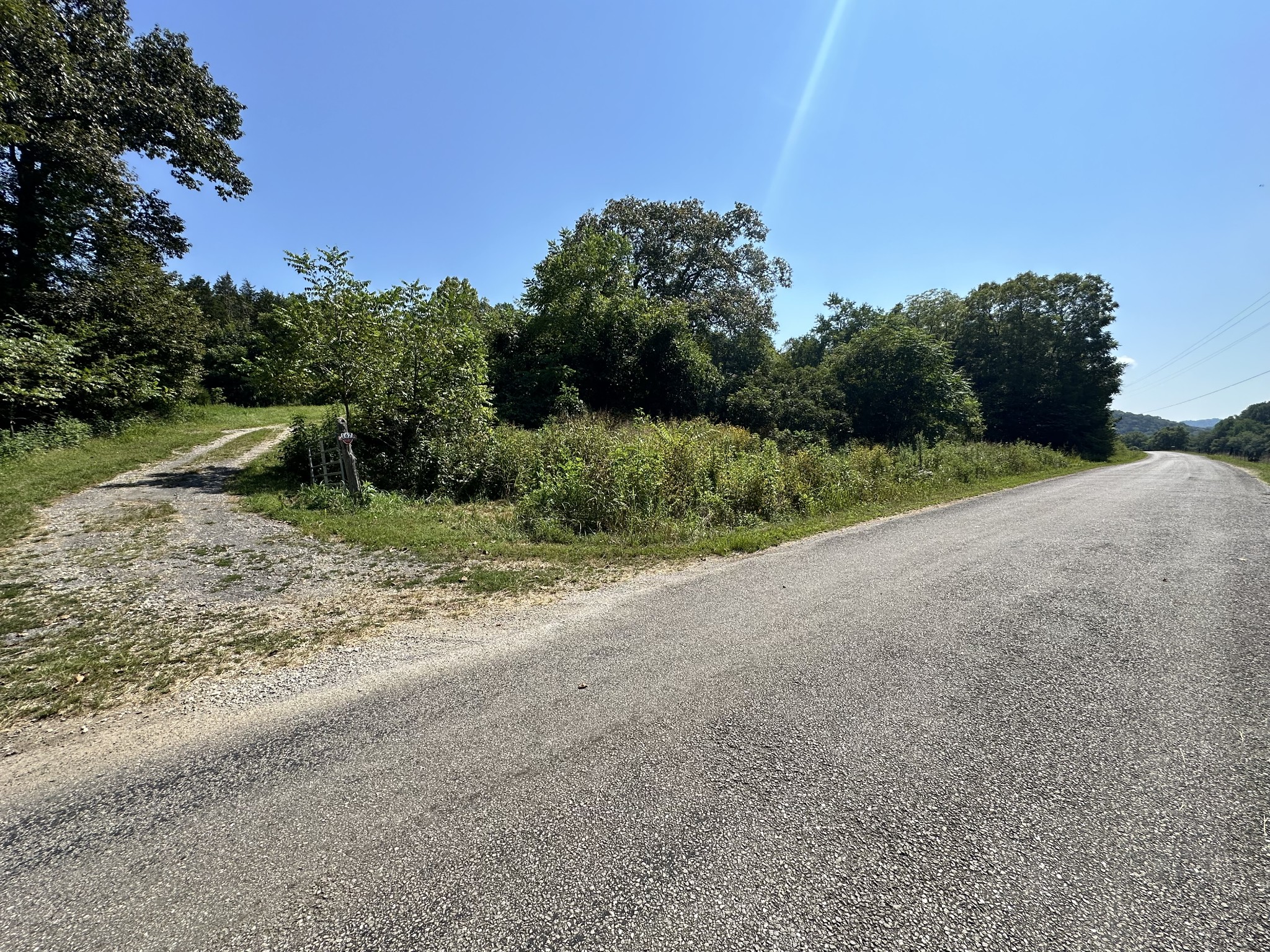 167 Green Hill Road Pleasant Shade, TN 37145 - Photo 11 of 43 a view of a dirt road with a building in the background