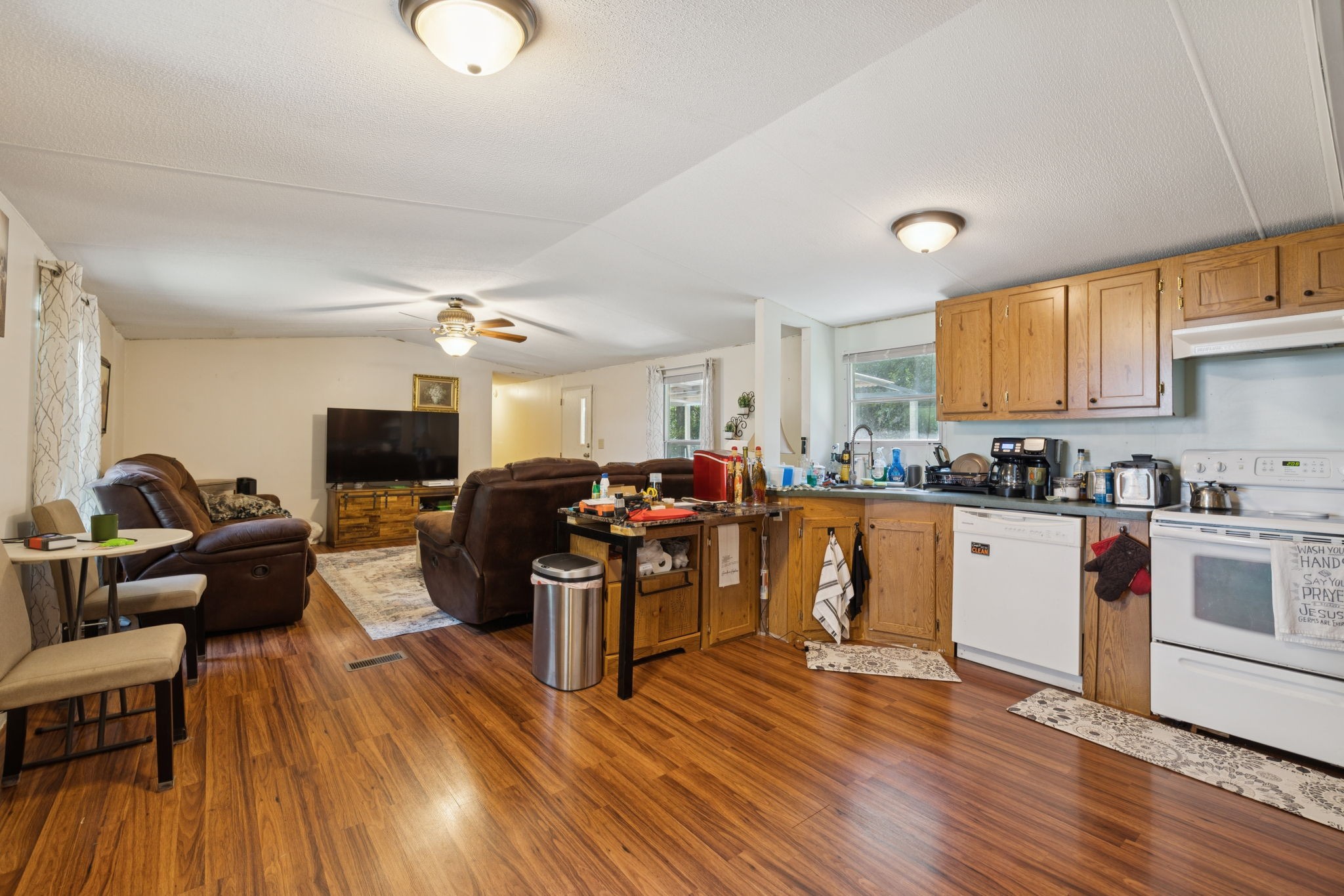 167 Green Hill Road Pleasant Shade, TN 37145 - Photo 19 of 43 a living room with furniture kitchen view and a wooden floor