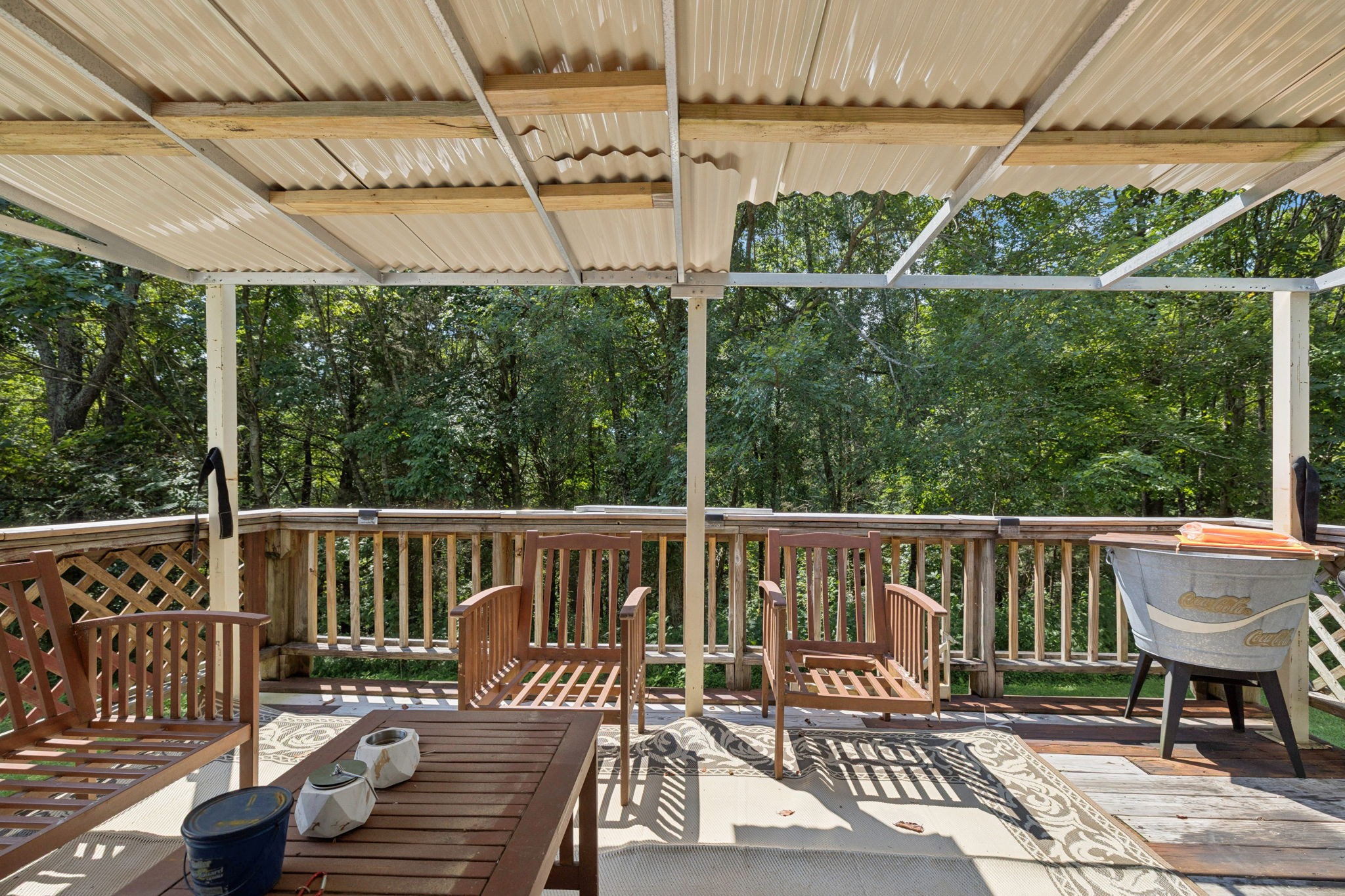 167 Green Hill Road Pleasant Shade, TN 37145 - Photo 28 of 43 a view of a deck with two chair and wooden floor
