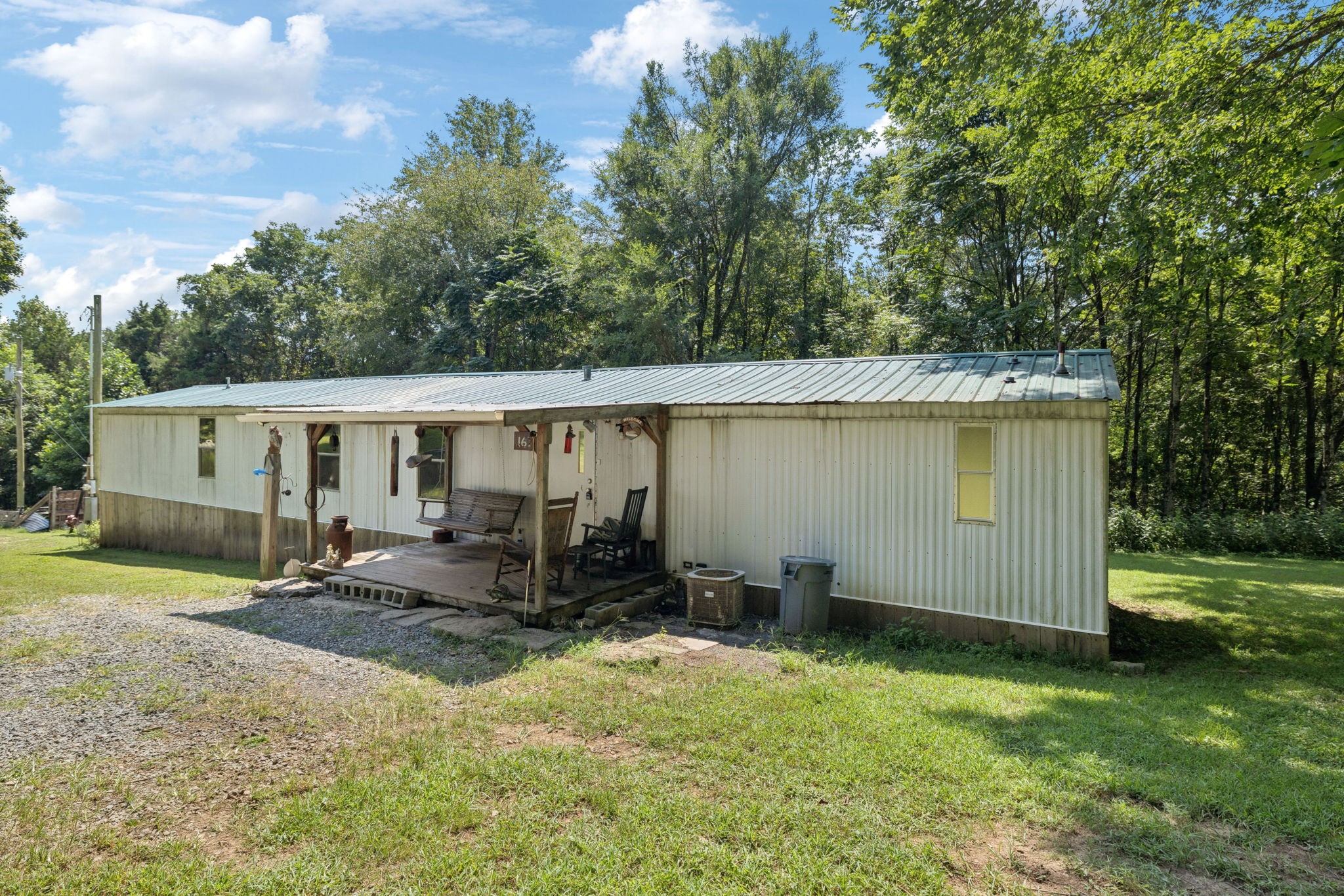 167 Green Hill Road Pleasant Shade, TN 37145 - Photo 30 of 43 a backyard of a house with yard table and chairs