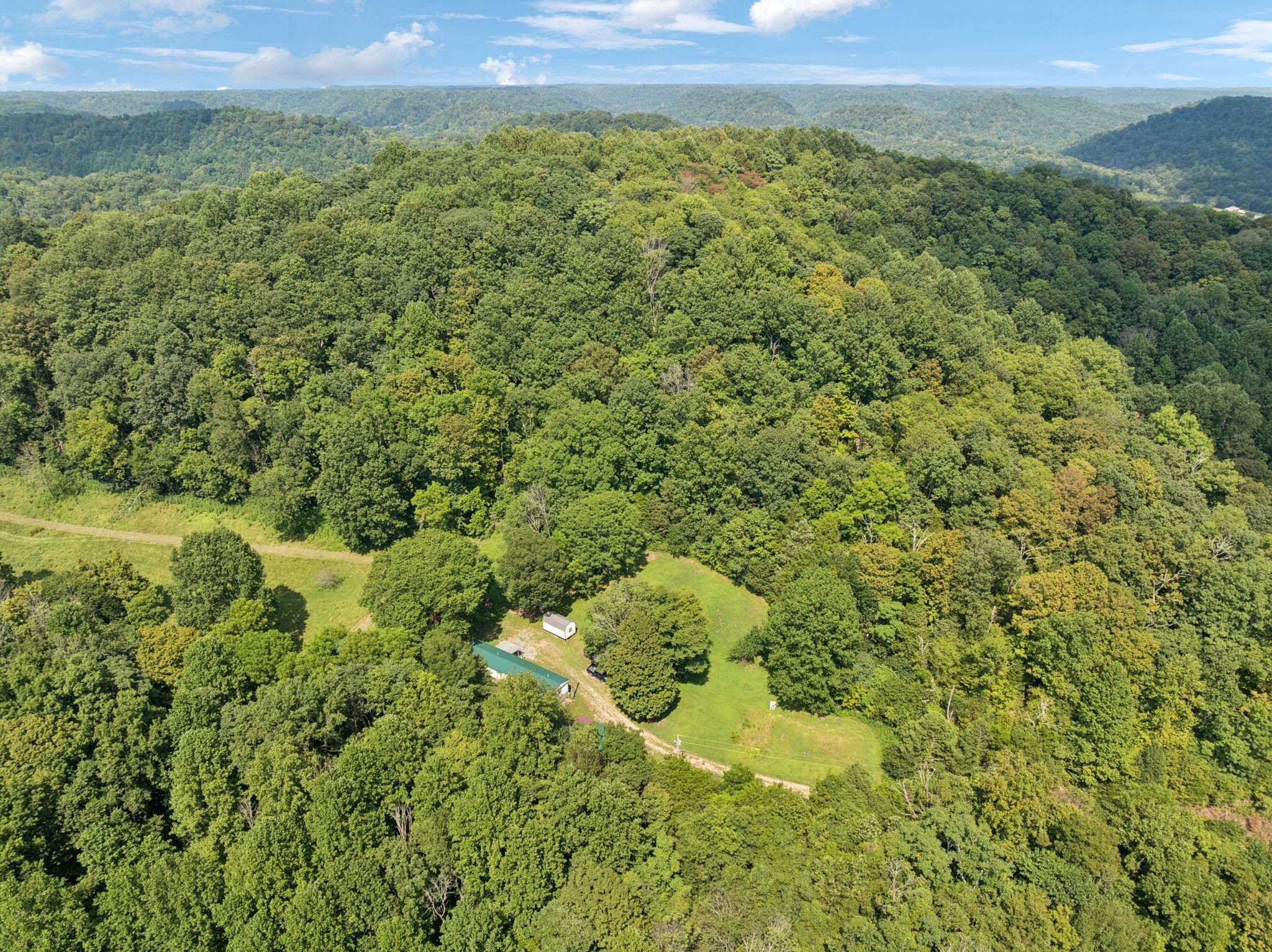 167 Green Hill Road Pleasant Shade, TN 37145 - Photo 35 of 43 a view of a big yard with lots of green space and mountain view