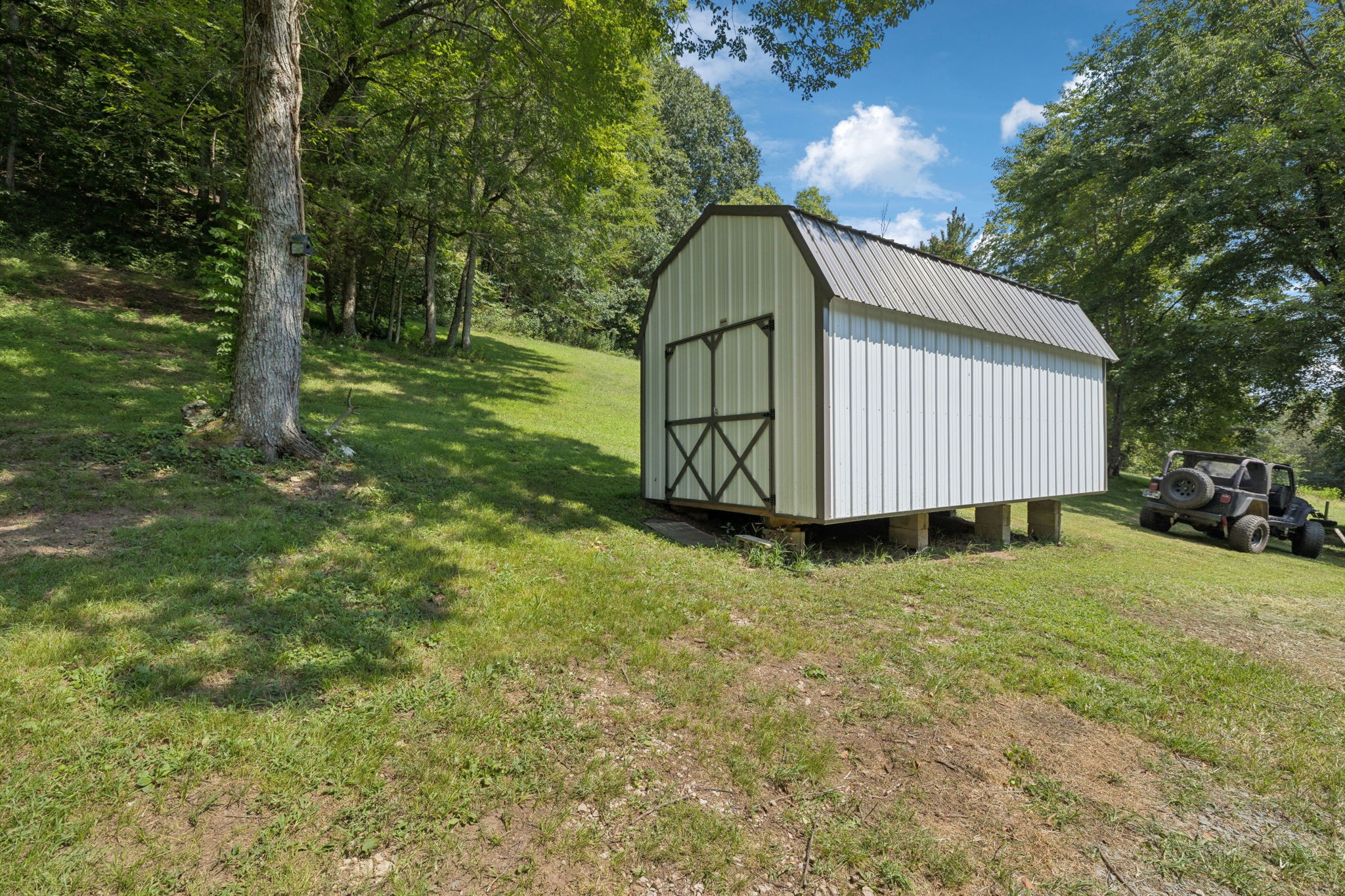 167 Green Hill Road Pleasant Shade, TN 37145 - Photo 8 of 43 a house view with a garden space